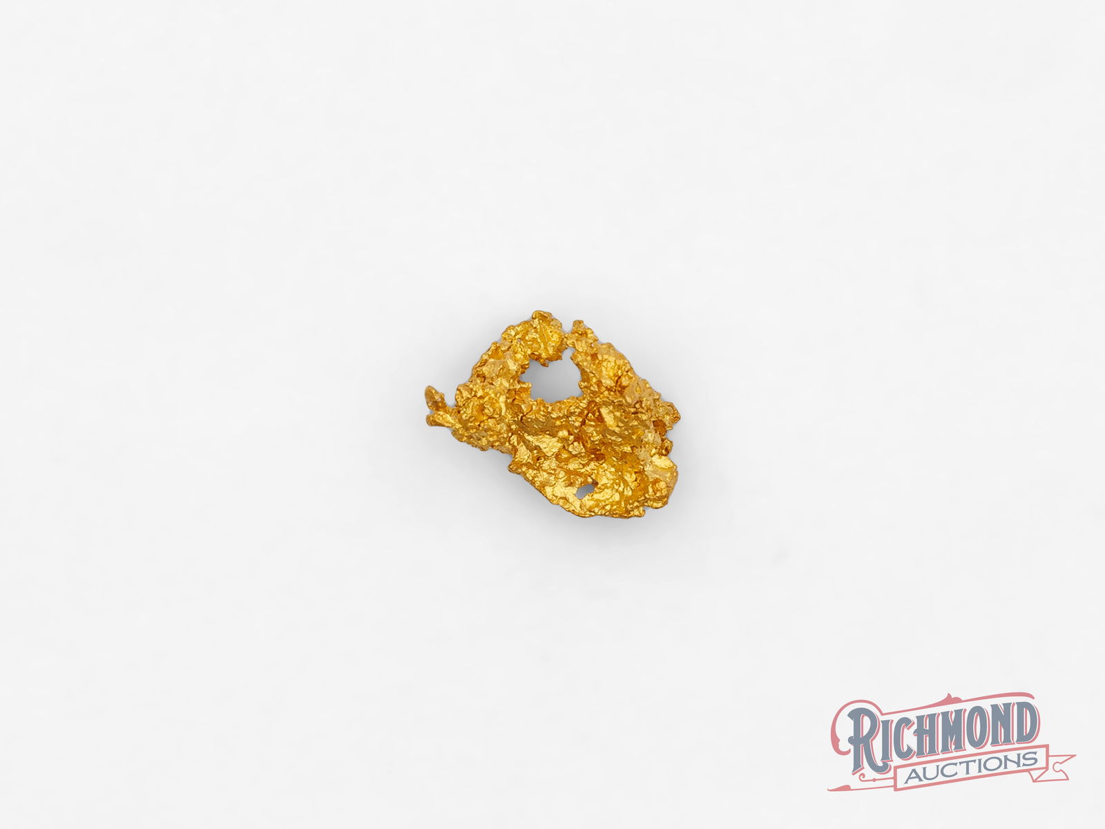 0.7g Natural Gold Nugget: Recovered from the legendary Kalgoorlie Goldfields, this alluvial nugget was found by full-time prospectors committed to working the land. Its unique shape and texture are the result of nature alone,