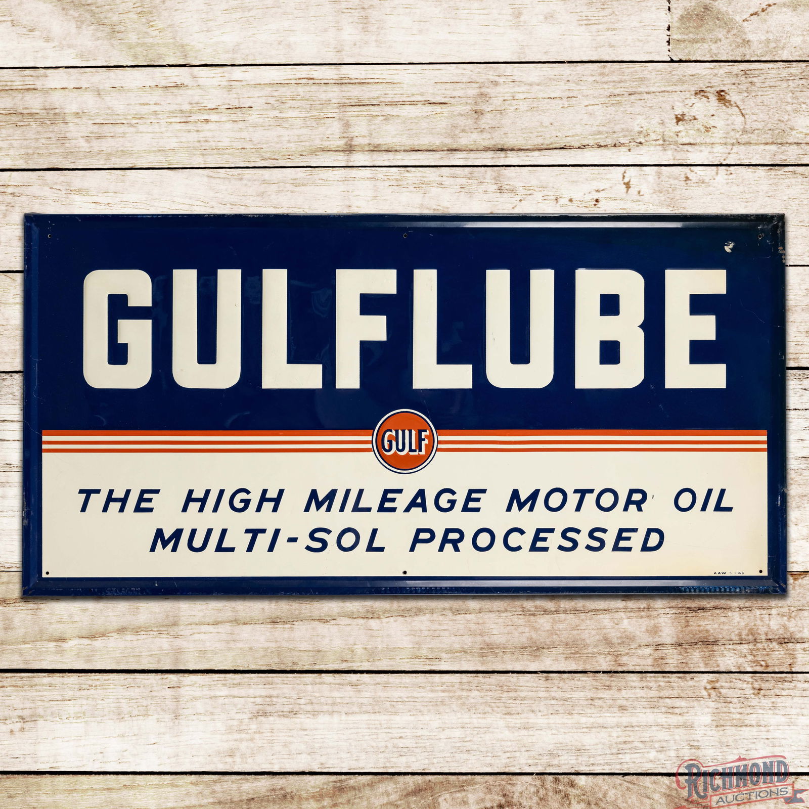 1948 Gulflube "The High Mileage Motor Oil" Emb. Single Sided Tin Sign w/ Logo: SST (Single Sided Tin) embossed self-framed sign has outstanding color and shine. The field has light wear with minor fine scratches and a small indentation with a paint chip and scratch in the lower
