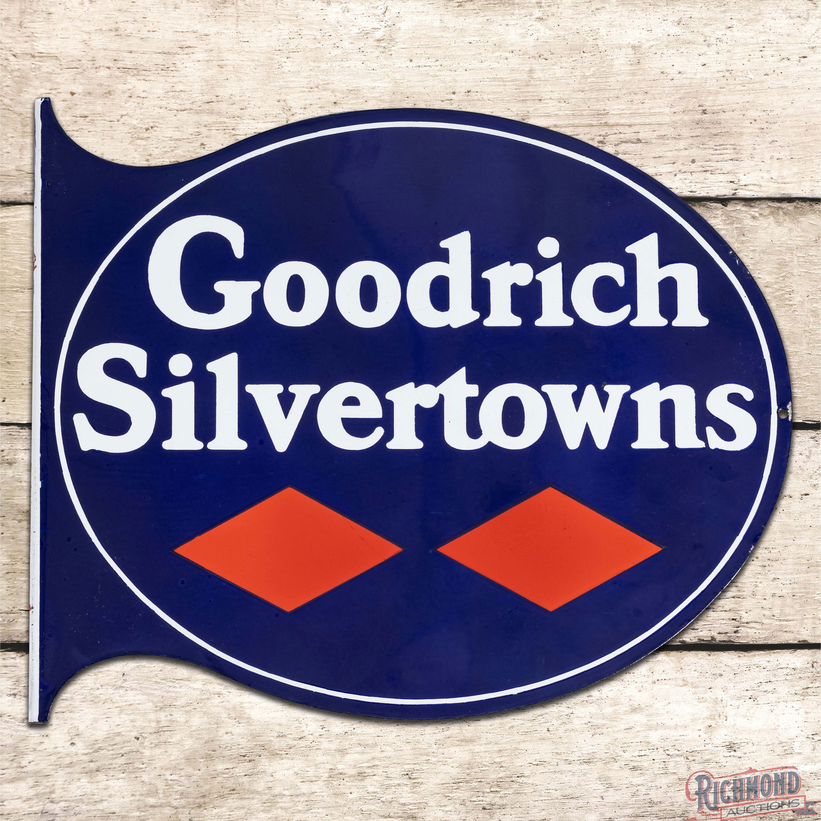 Impressive Goodrich Silvertowns Tires Double Sided Porcelain Flange Sign: DSP (Double Sided Porcelain) flange has day one color and gloss. The display is exceptionally clean with minor surface imperfections and small chips along the outer right edge. The reverse has