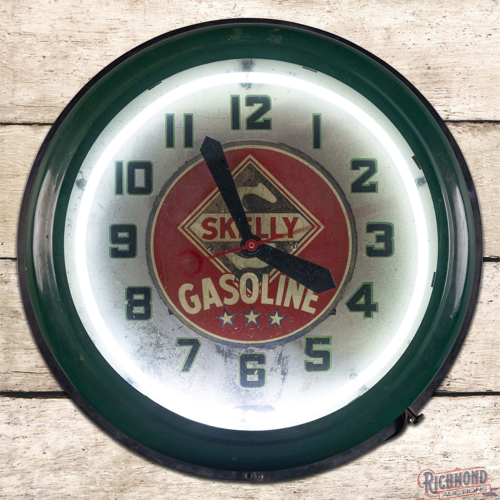 Neon Products 21" Advertising Clock "Skelly Gasoline": Neon Products neon advertising clock runs and lights as it should. The clock features single color neon with an older Skelly Gasoline decal applied in the center field. When viewed at an angle