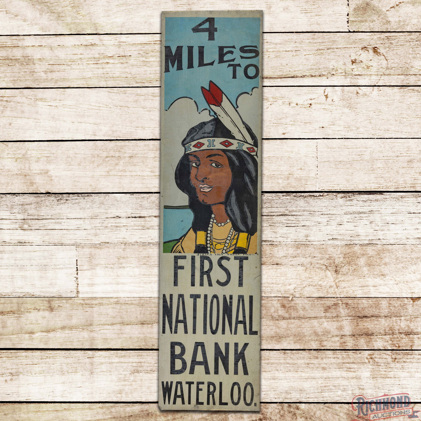 NOS 4 Miles to First National Bank Waterloo Single Sided Tin Ithaca Sign w/ Native American Maiden: NOS (New Old Stock) SST (Single Sided Tin) sign has excellent color and shine. The field features a detailed graphic of a Native American maiden.. The sign exhibits light storage wear with a scratch