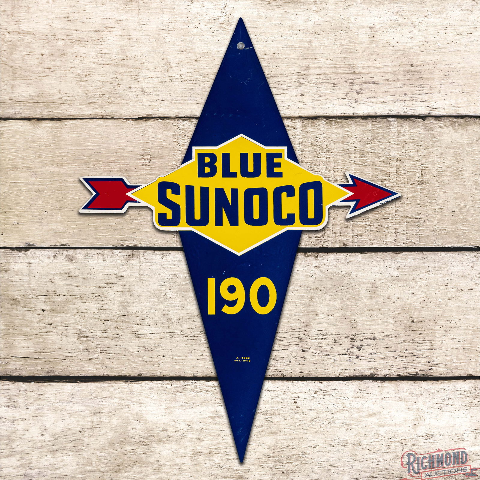 Blue Sunoco 190 Single Sided Tin Die Cut Gas Pump Plate Sign: SST (Single Sided Tin) die cut sign has excellent color and shine. The field exhibits minor surface imperfections with a horizontal bend above the logo in the upper field. The perimeter has an added