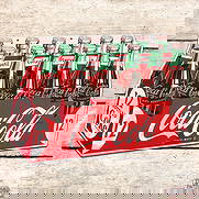 1954 Coca Cola Single Sided Tin Die Cut 12 Pack Sign: SST (Single Sided Tin) die cut sign has outstanding color and shine. The display field of the sign is exceptionally clean. The outer fields exhibit light wear with fine scratches and an area of