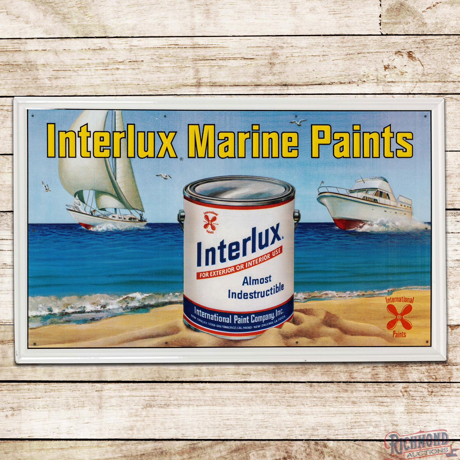 Impressive Interlux Marine Paints Emb. Single Sided Tin Sign w/ Ocean Scene: SST (Single Sided Tin) embossed self-framed sign has exceptional color and shine. The sign features an amazing beach scene with boats and a large Interlux Paint can graphic. The display is clean with