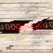 Liquors 7' Double Sided Porcelain Factory Neon Arrow Sign: DSP (Double Sided Porcelain) factory neon sign mounted on the original metal can has very good color and gloss. Side #1 exhibits light surface wear with small chips, discoloration and unused stand