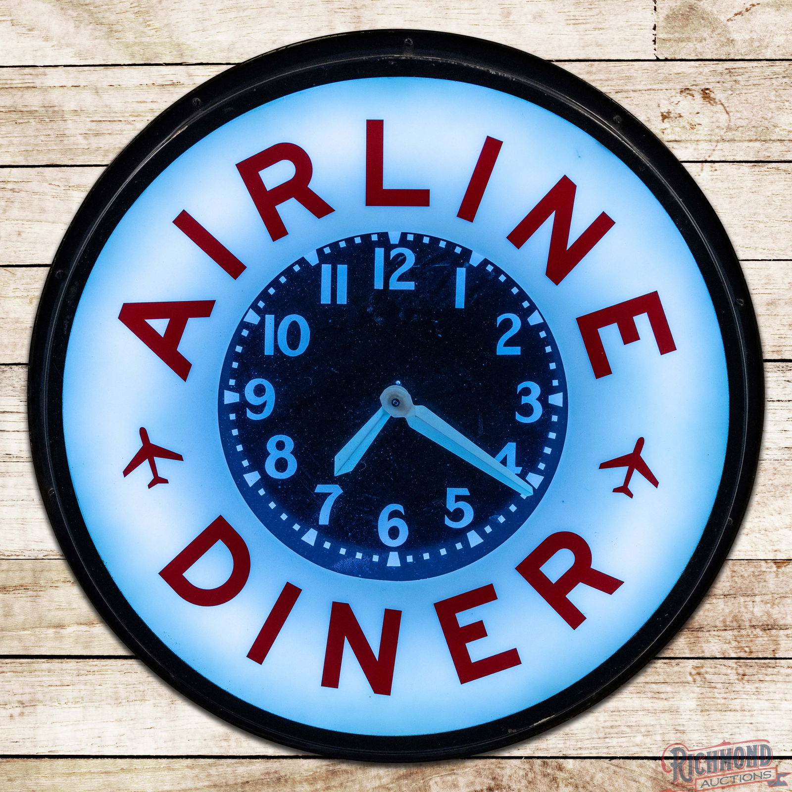 Airline Diner 26" Neon Advertising Clock: 26" neon advertising clock works and lights as it should. The clock has been restored and displays very well. The inner face has minor imperfections in the lower fields and the hands show age toning.
