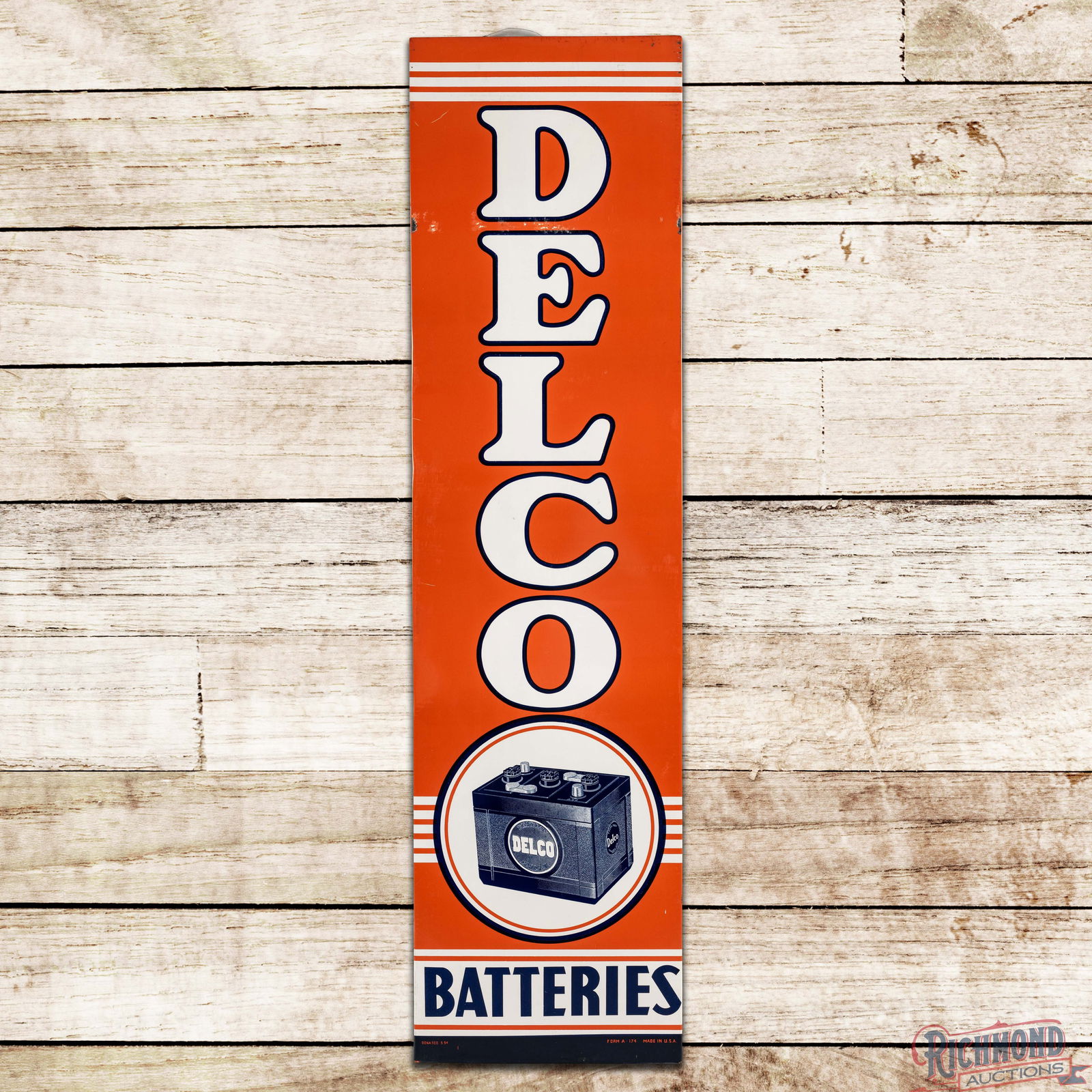 1954 Delco Batteries Single Sided Tin Sign w/ Logo: SST (Single Sided Tin) sign with factory wooden frame has excellent color and shine. The field is very clean overall with an area of surface wear and rubs between the "D & E" in the upper field. The