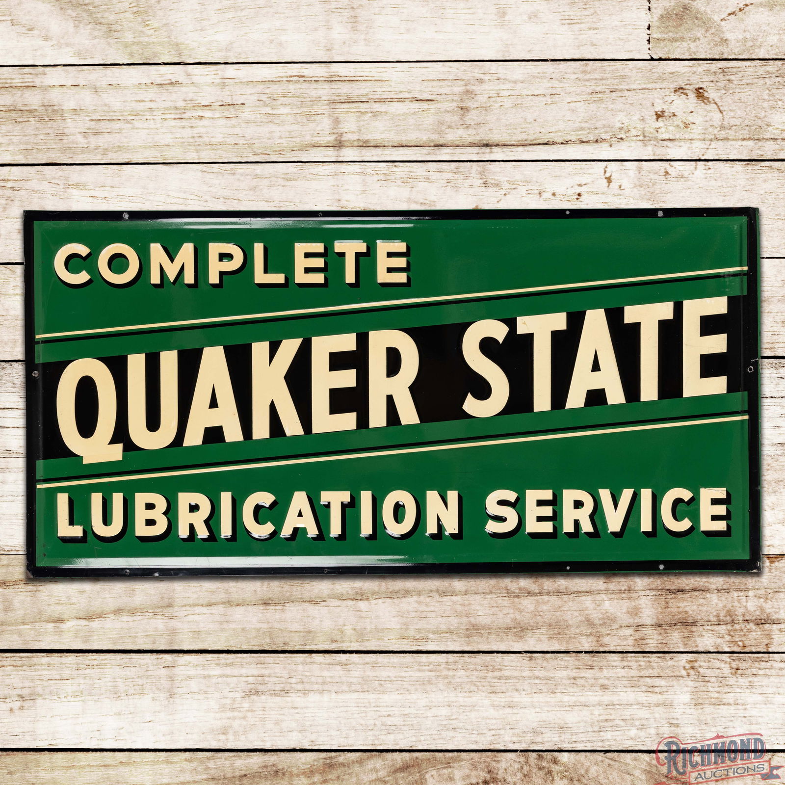 Complete Quaker State Lubrication Service 4' Emb. Single Sided Tin Sign: SST (Single Sided Tin) embossed sign has excellent color and shine. The field exhibits light wear with toning to the lettering. The outer fields have surface rubs and scratches to the lettering along
