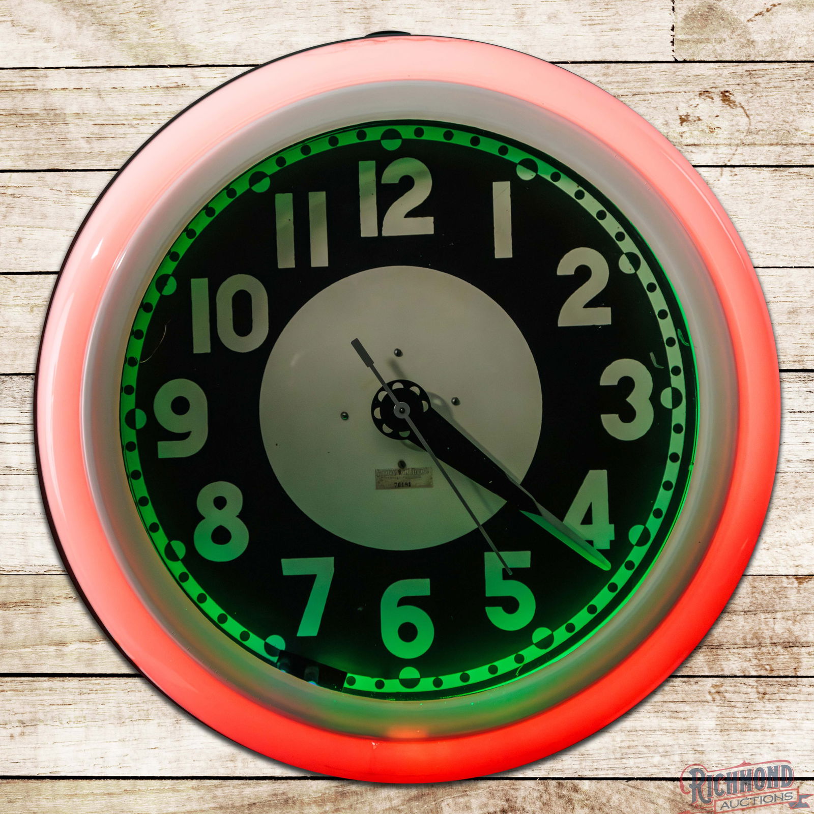 Cleveland 25" Neon Advertising Clock: Cleveland neon advertising clock lights and runs as it should. The clock features vibrant two-color neon and displays very well. The inner face and hands are clean with light wear and tiny paint chips