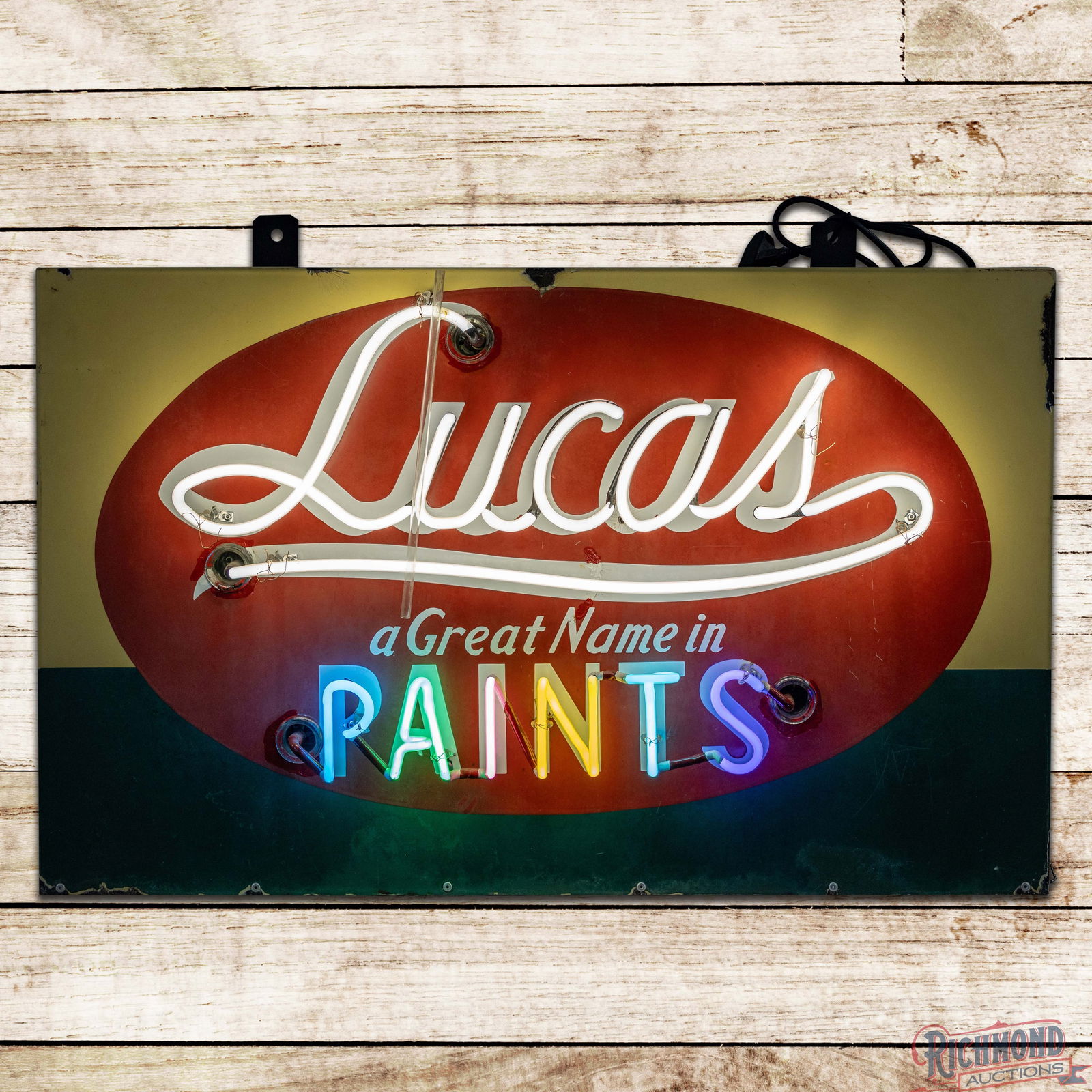 Lucas A Great Name in Paints Single Sided Porcelain Neon Sign: SSP (Single Sided Porcelain) sign with added neon and metal can has moderate color and gloss. The sign features four-color porcelain enamel with seven-color neon. The display has fading with a non-fac