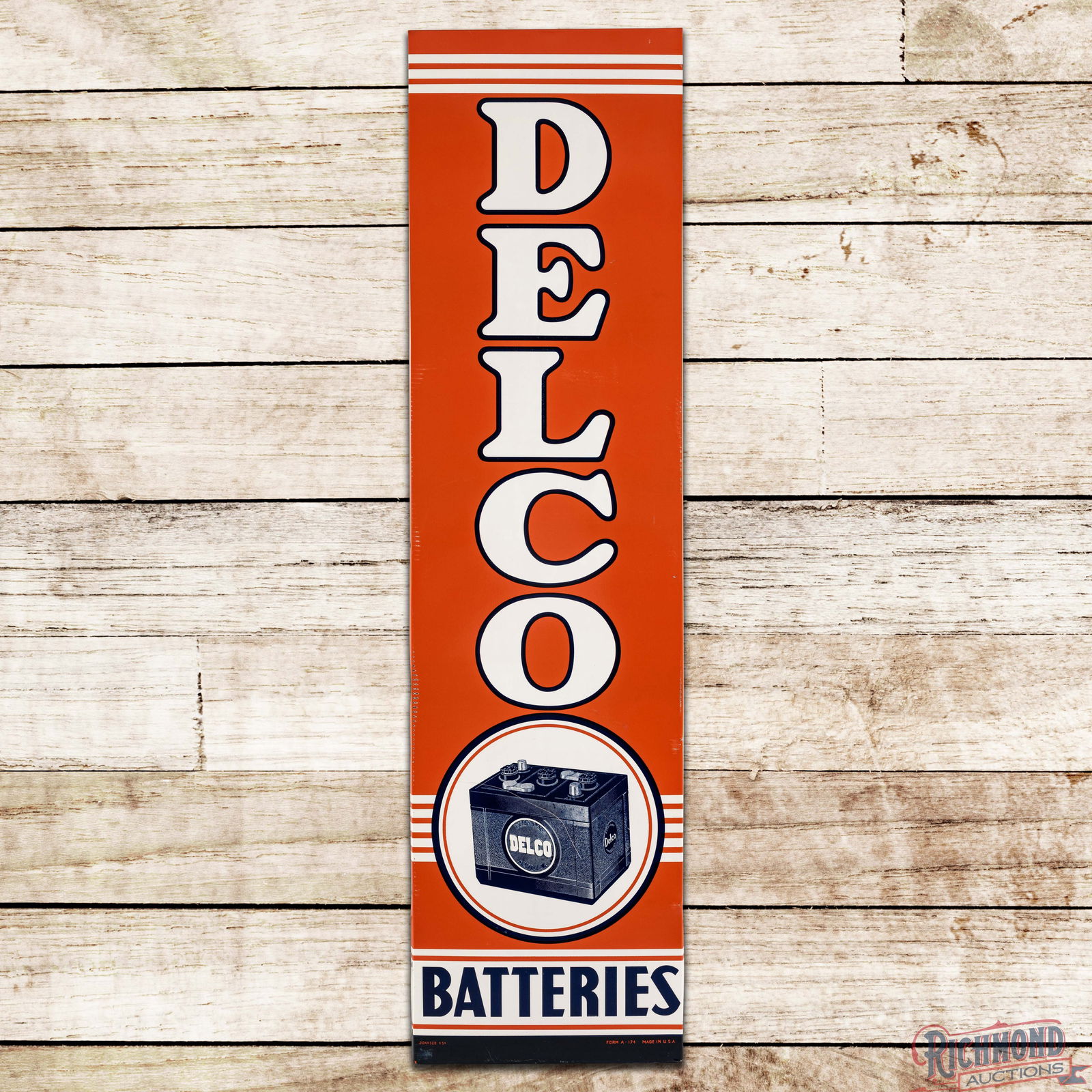 1954 Delco Batteries Vertical 6' Single Sided Tin Logo Sign: SST (Single Sided Tin) sign with factory wooden frame has excellent color and shine. The field has light wear with a scratch in the battery graphic in the lower fields. The perimeter has edge wear