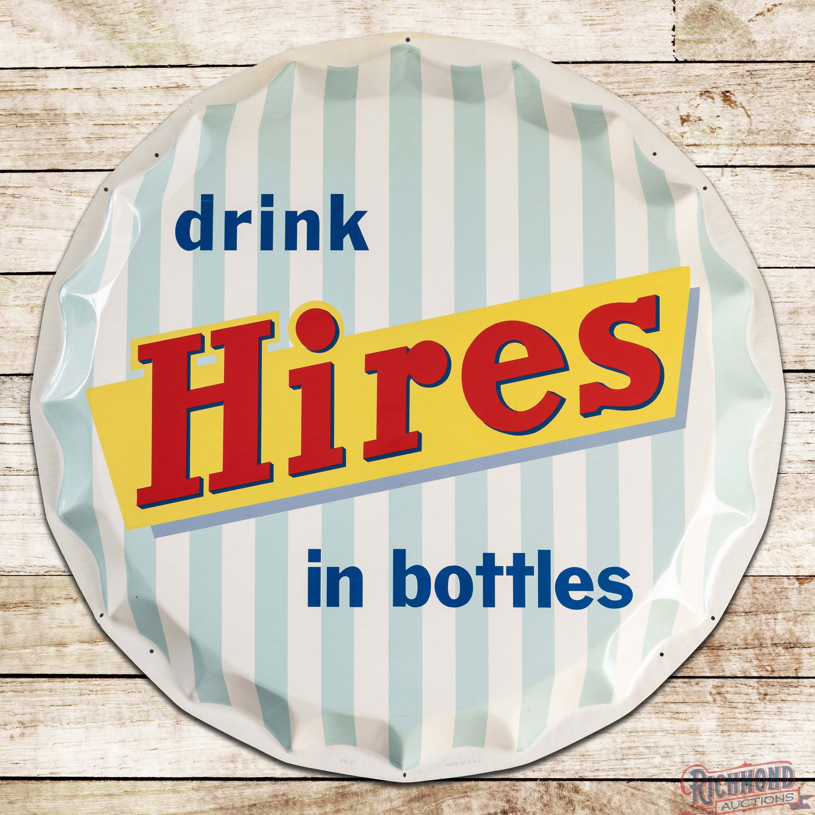 Drink Hires in Bottles 35" Die Cut Single Sided Tin Bottle Cap Sign: SST (Single Sided Tin) die cut convex sign has outstanding color and shine. The field is exceptionally clean with faint paper marks in the red lettering and minor surface wear. The perimeter has
