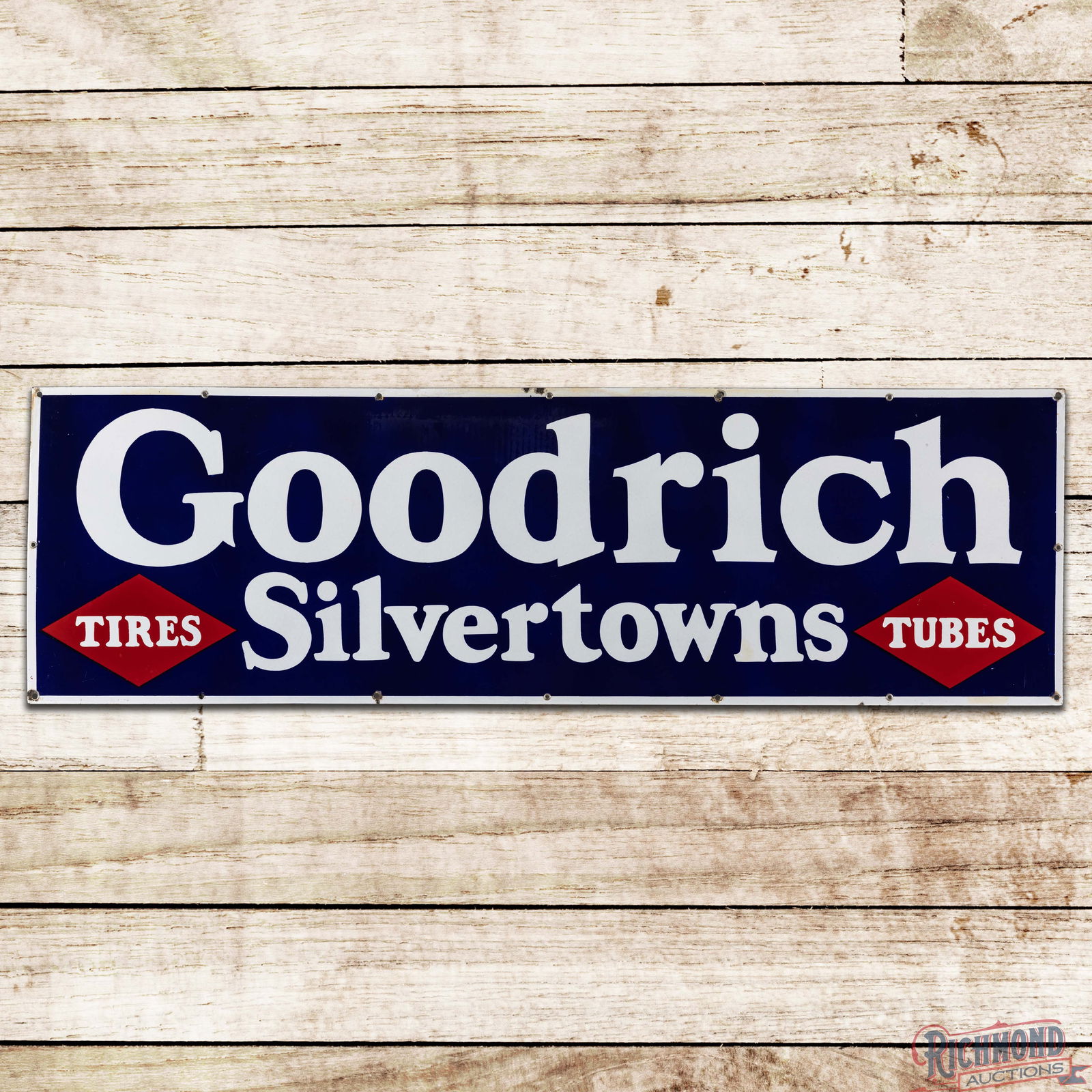 Goodrich Silvertowns Tires Tubes 5' Single Sided Porcelain Sign: SSP (Single Sided Porcelain) sign has excellent color and gloss. The field has minor imperfections with an area of paper marks and lower gloss in the center field at the "OD" in Goodrich. The lower le
