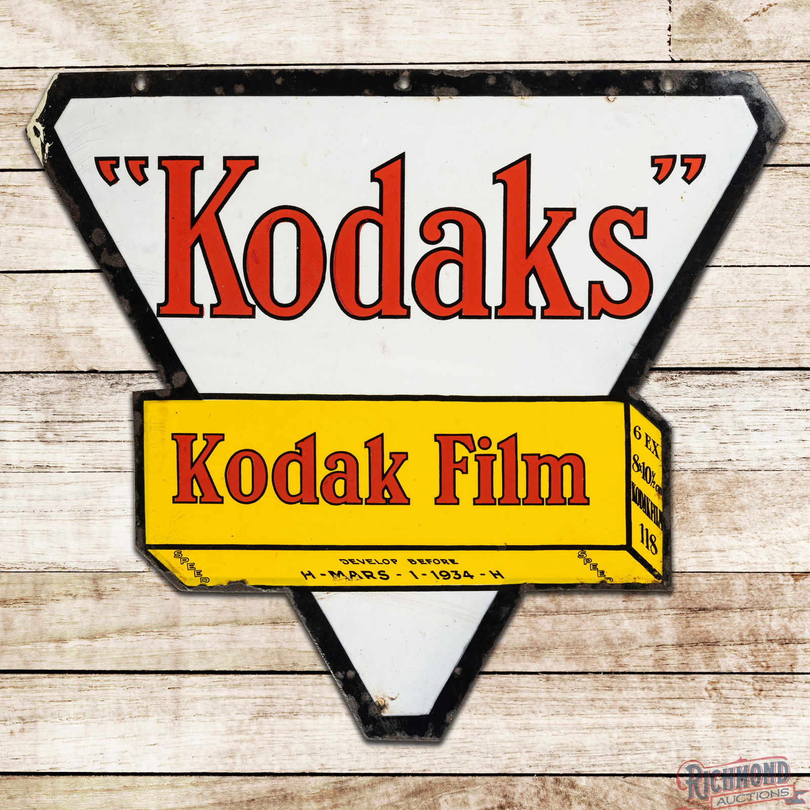Kodak Eastman Autographic Camera Film Cartridge Die Cut Double Sided Porcelain Sign: DSP (Double Sided Porcelain) die cut sign has very good color and gloss. The display has light wear with a bruise in the field. The outer fields and perimeter have areas of crazing with small chips