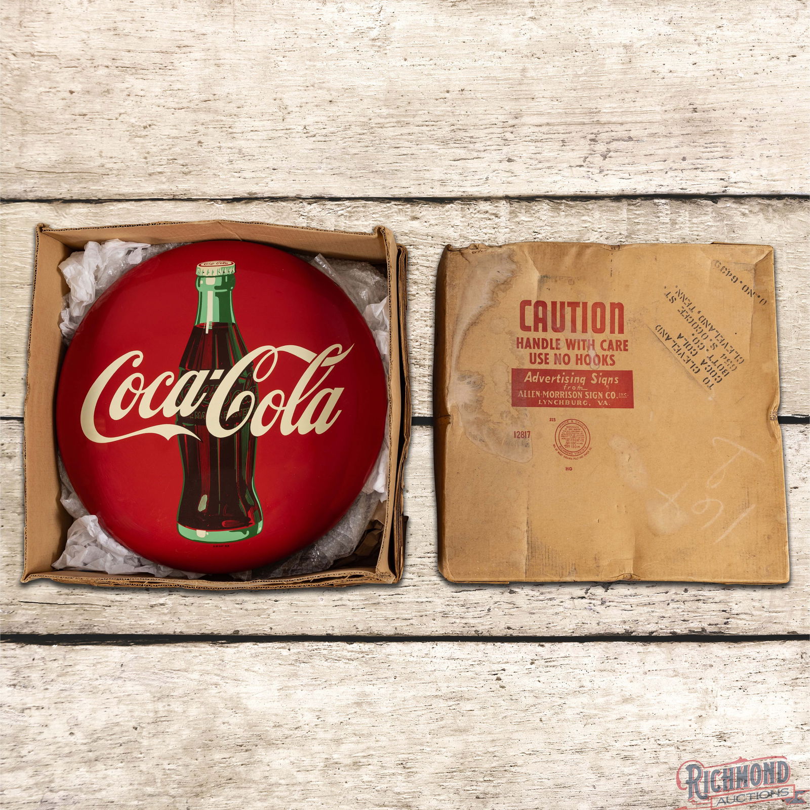 NOS 1957 Coca Cola Single Sided Tin Button Sign w/ Bottle & Original Box: SST (Single Sided Tin) button sign with the original shipping box has excellent color and shine. The field is clean. The outer fields and perimeter have minor storage marks with small fine scratches.