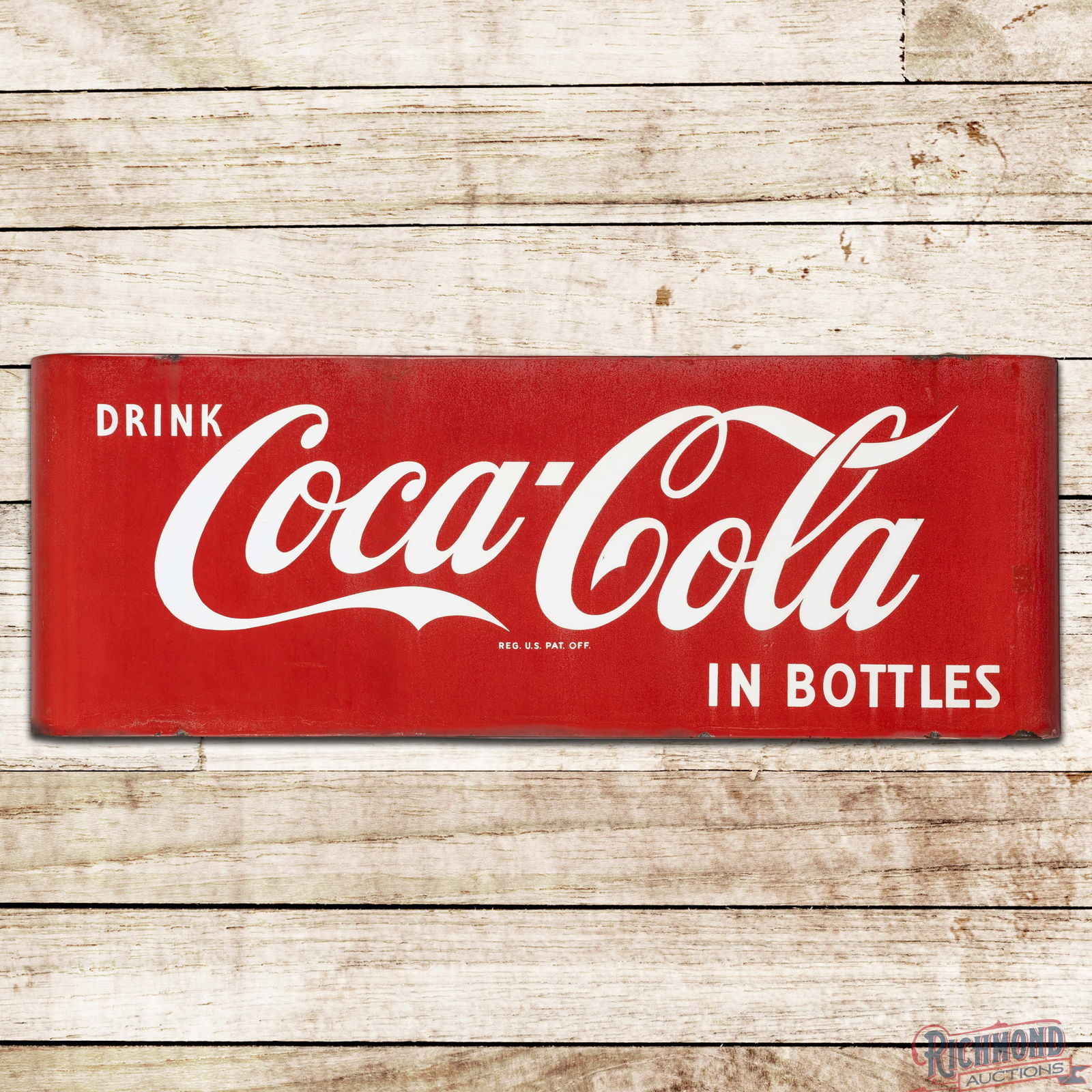 Drink Coca Cola in Bottles 44" Single Sided Porcelain Sled Sign: SSP (Single Sided Porcelain) sled Coke sign has good color. The field has small imperfections and the red porcelain enamel is cloudy. The perimeter has areas of discoloration with edge chips and minor