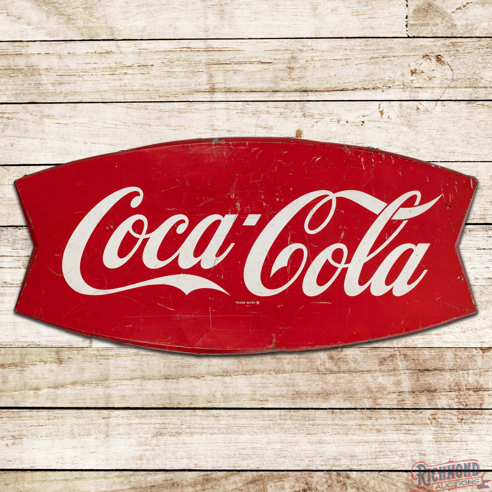 Coca Cola 5' Convex Single Sided Tin Fishtail Sign: SST (Single Sided Tin) convex die cut Coke sign has good color and moderate shine. The field has general surface wear with scratches and paint chips. The perimeter has bends with areas of paint loss.