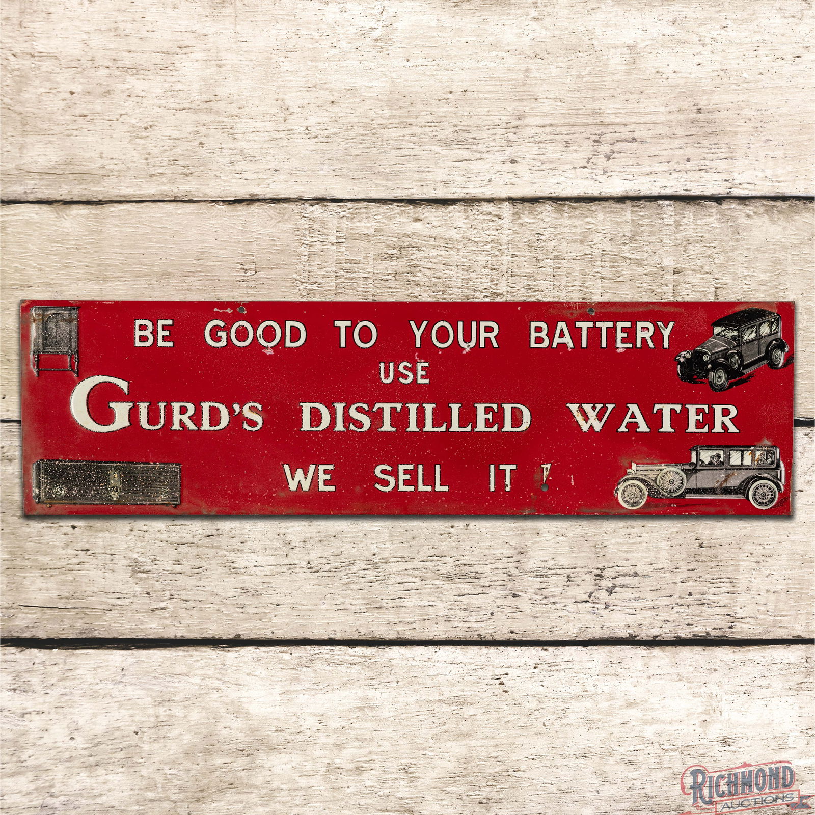 Be Good to Your Battery Use Gurd's Distilled Water Emb. Single Sided Tin Sign w/ Early Automobiles: SST (Single Sided Tin) crimped edge sign has very good color and shine. The field exhibits spotting with small scuffs and tiny paint chips. The perimeter has similar wear with areas of minor oxidation