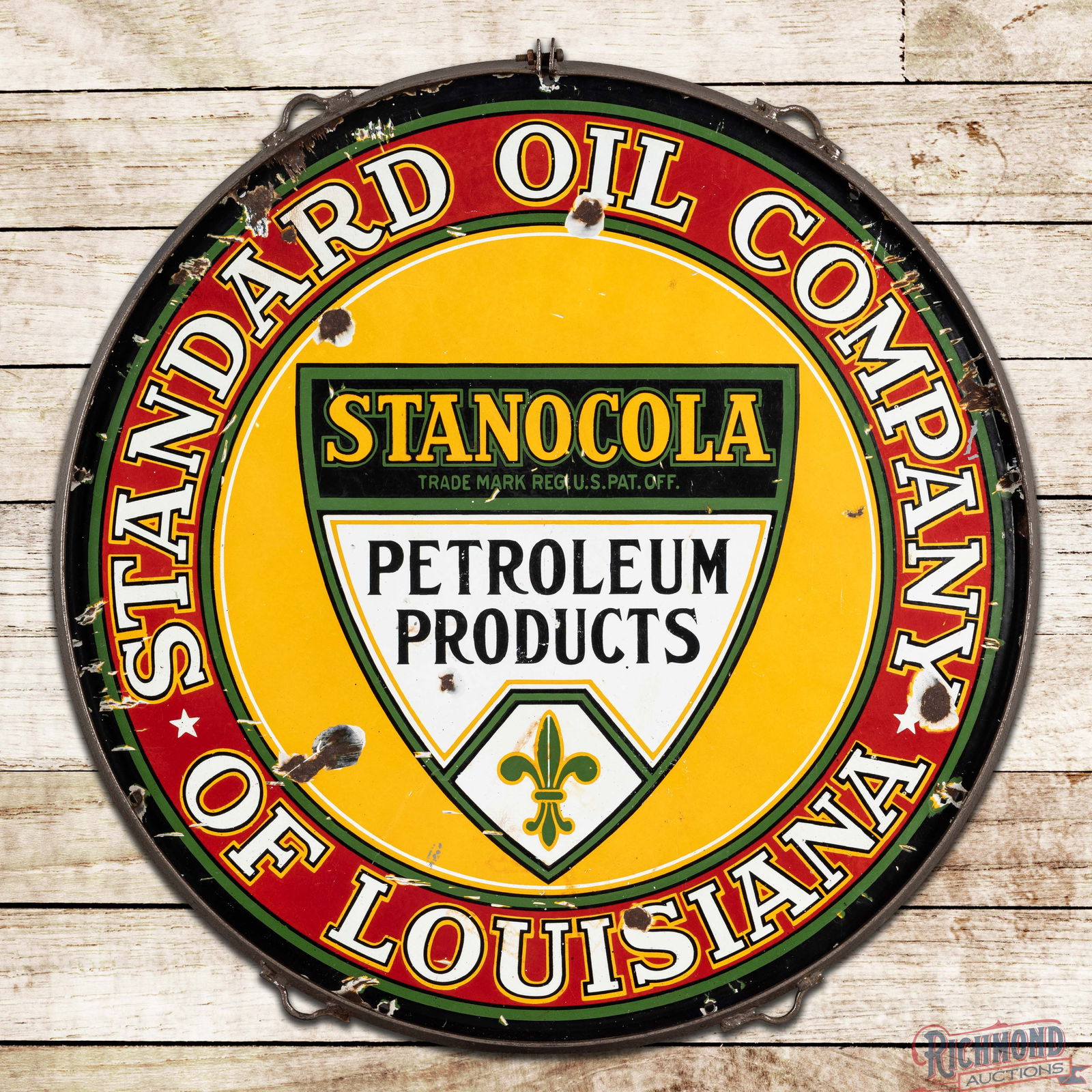 Stanocola Standard Oil Company of Louisiana 30" Single Sided Porcelain Logo Sign w/ Ring: SSP (Single Sided Porcelain) sign has good color and gloss. The field exhibits surface wear and chips with additional wear along the perimeter. The metal ring is in very good condition and the sign is