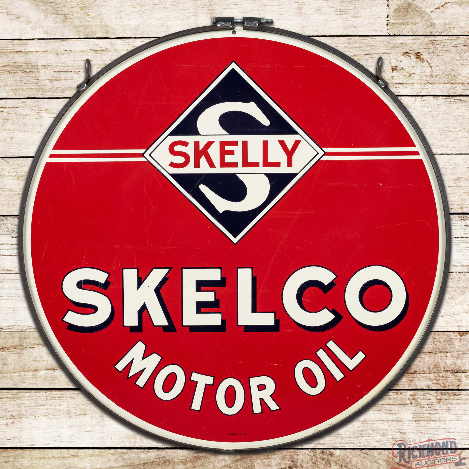 Skelly Fortified Tagolene & Skelco Motor Oils 30" Double Sided Tin Logo Sign w/ Ring: DST (Double Sided Tin) sign has excellent color and shine. One side of the sign advertises Skelly Fortified Tagolene Motor Oil and the other advertises Skelly Skelco Motor Oil. Side #1 is exceptionall
