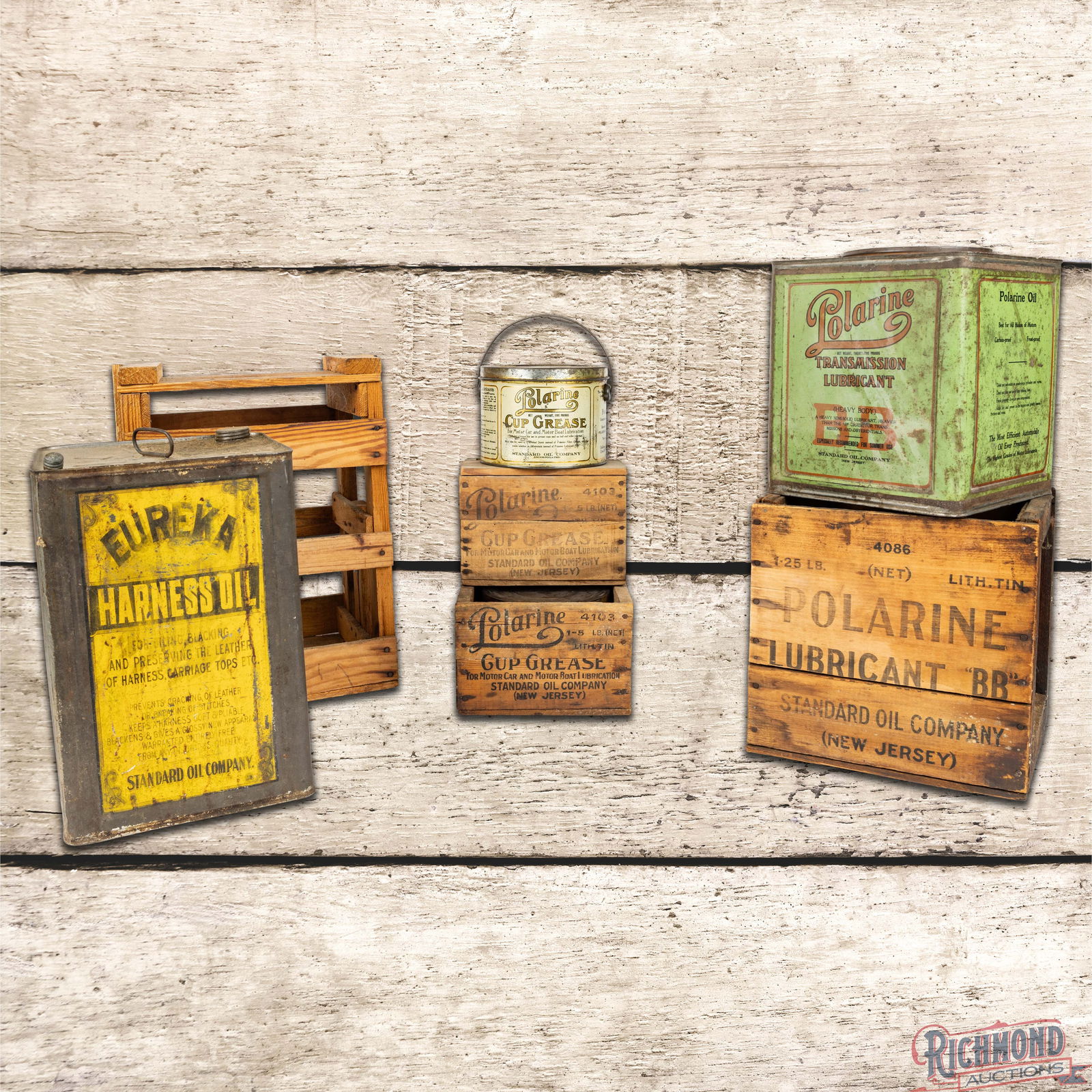 Group of Four Standard Polarine Grease & Oil Cans w/ Wooden Crates: The group includes two five pound grease cans with wooden crates, a Polarine BB 25 pound can with wooden crate and n Eureka Harness Oil 5 gallon can with wooden crate. The Polarine cans have very