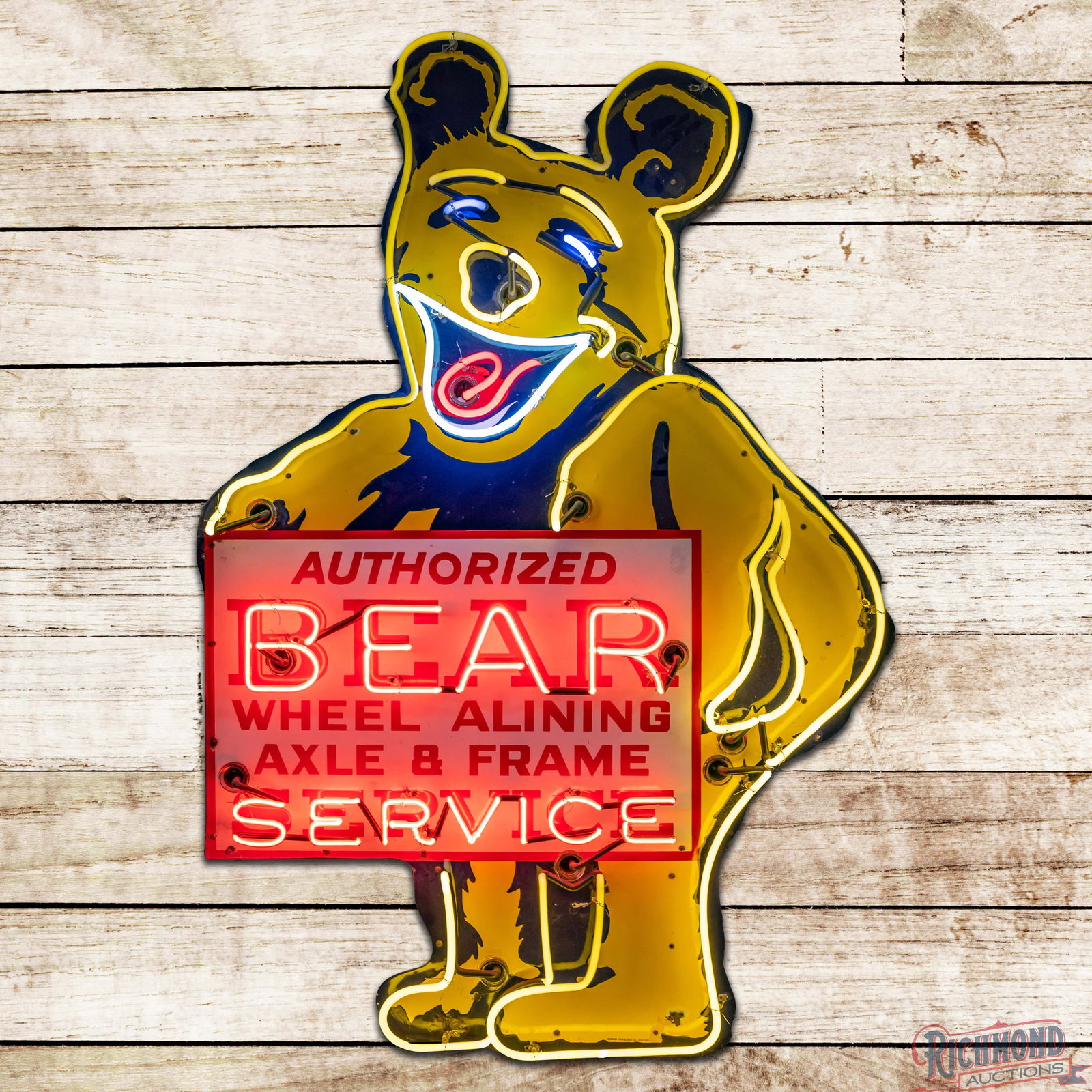 Authorized Bear Wheel Alining Axle & Frame Service 5.5' Single Sided Porcelain Die Cut Neon Sign: SSP (Single Sided Porcelain) die cut sign with added neon and a metal can has excellent color and gloss. The sign features four-color neon highlighting the iconic bear graphic. The display has light w