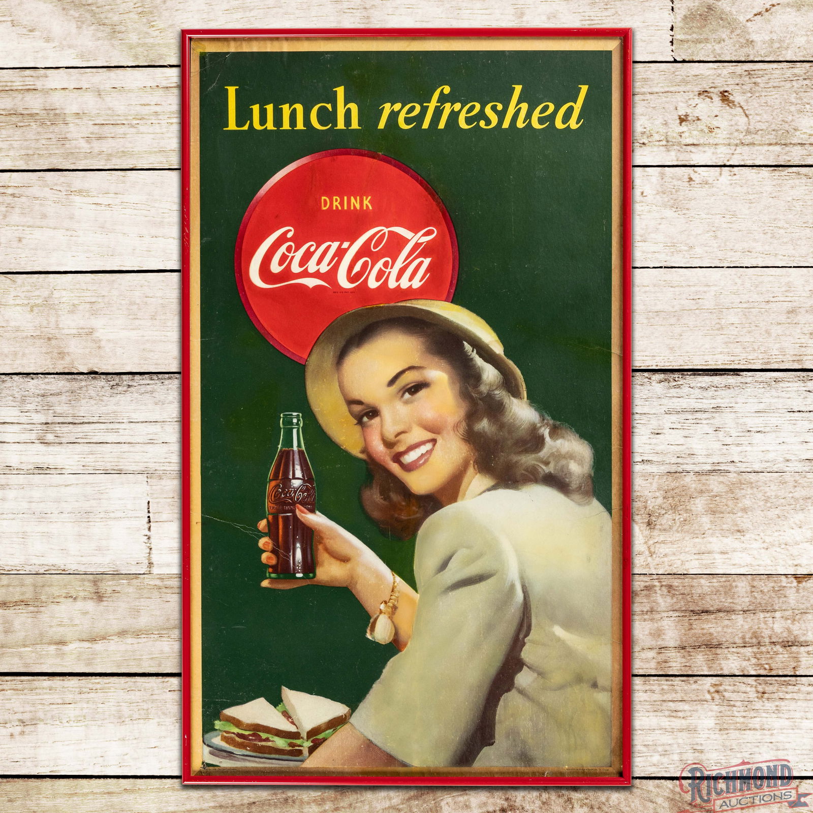 1948 Drink Coca Cola "Lunch Refreshed" Framed w/ Lady & Bottle: Single sided Coke cardboard advertising has been framed under glass. The field has spotting, surface imperfections, creases and color match in and around the Drink Coca Cola logo. The perimeter has