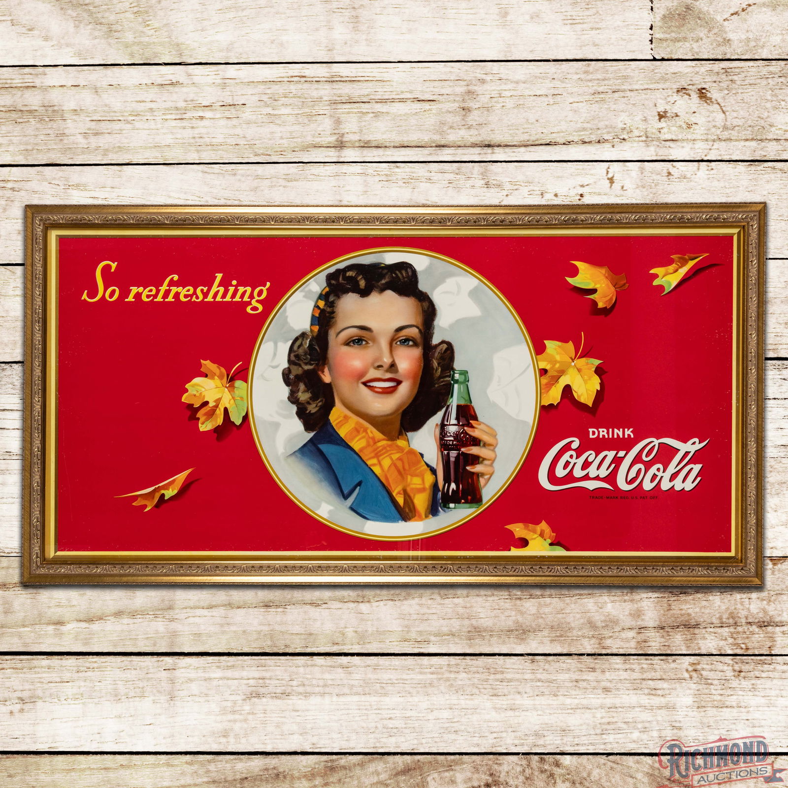 Drink Coca Cola "So Refreshing" Framed Cardboard Lithograph Sign w/ Fall Scene: Single sided cardboard lithograph sign has been framed under glass with a wooden frame. The sign has outstanding color with detailed graphics of a lady with a Coke bottle. The display is clean with