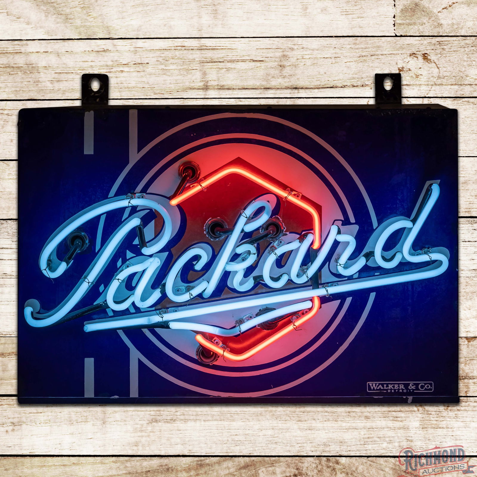 Packard Automobiles 30" Single Sided Porcelain Neon Sign w/ Logo: SSP (Single Sided Porcelain) rolled edge sign with added neon and a metal can has good color and gloss. The sign features two-color neon which outlines the classic Packard logo in the center field. Th
