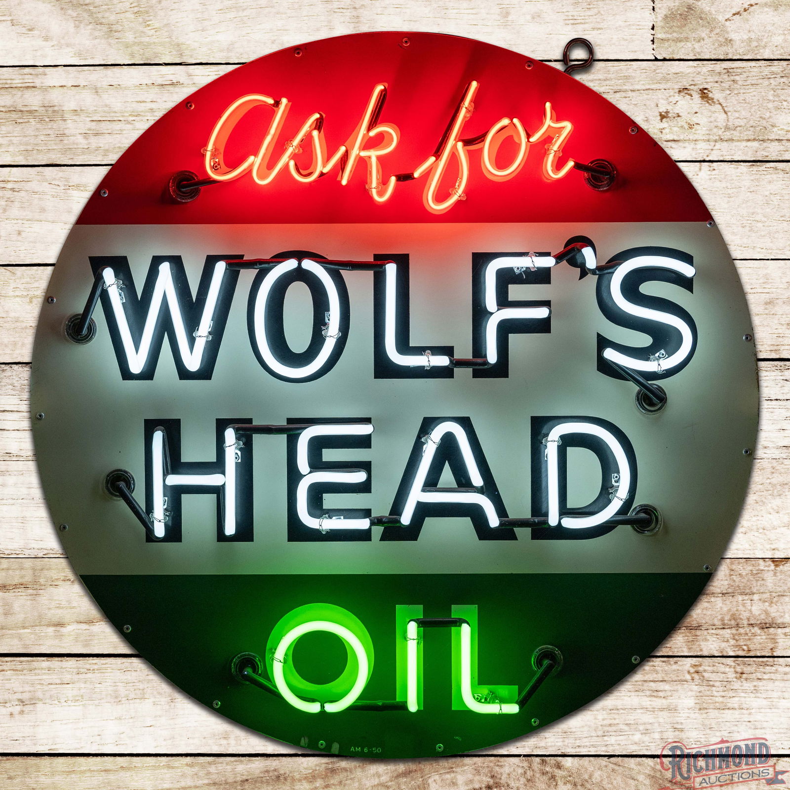 1950 Ask for Wolf's Head Oil 36" Single Sided Tin Neon Sign: SST (Single Sided Tin) sign with added neon and a new metal can has excellent color and shine. The sign features highly detailed three-color neon which accents the Wolf's Head colors perfectly. The