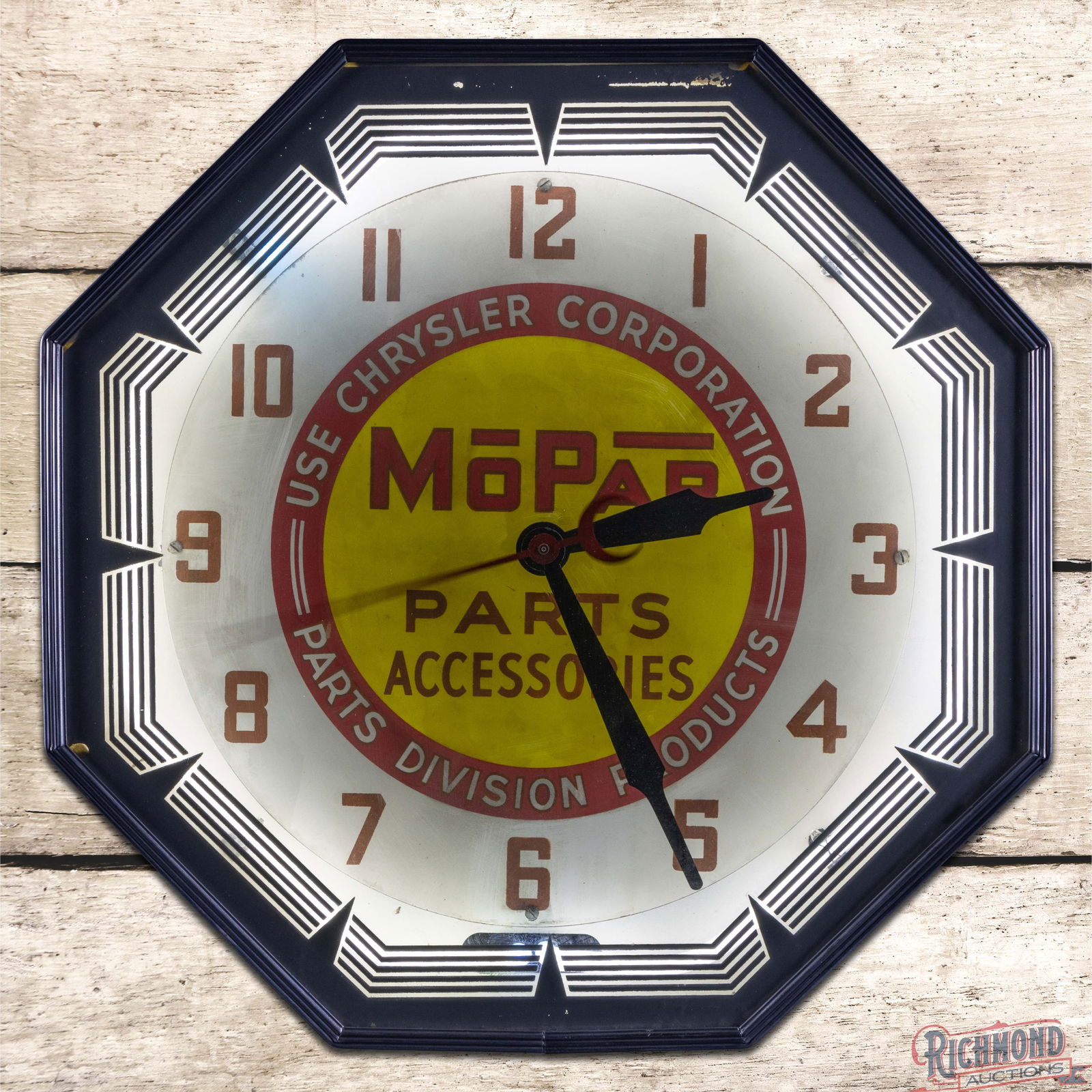 Neon Products 21" Mopar Parts Accessories Octagon Neon Advertising Clock: Neon Products neon advertising clock runs and lights as it should. The inner face light wear with areas of discoloration. The outer glass has small paint chips with light wear along the perimeter.