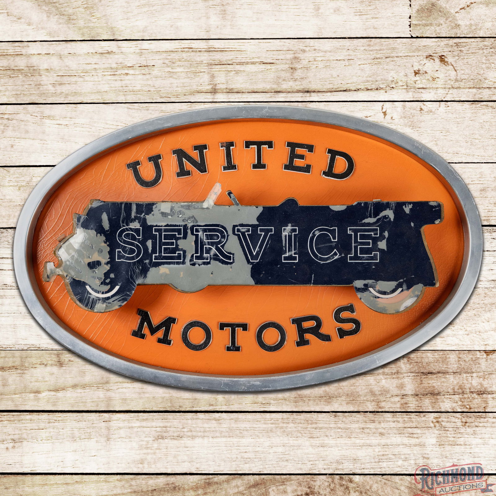 United Motors Service Countertop Lighted 3D Advertising Sign w/ Early Automobile: Single sided lighted three-dimensional Masonite advertising sign with the original metal can has good color. The car graphic in the field exhibits areas of discoloration and wear. The orange backgroun
