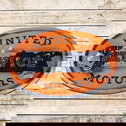 United Motors Service Countertop Lighted 3D Advertising Sign w/ Early Automobile: Single sided lighted three-dimensional Masonite advertising sign with the original metal can has good color. The car graphic in the field exhibits areas of discoloration and wear. The orange backgroun