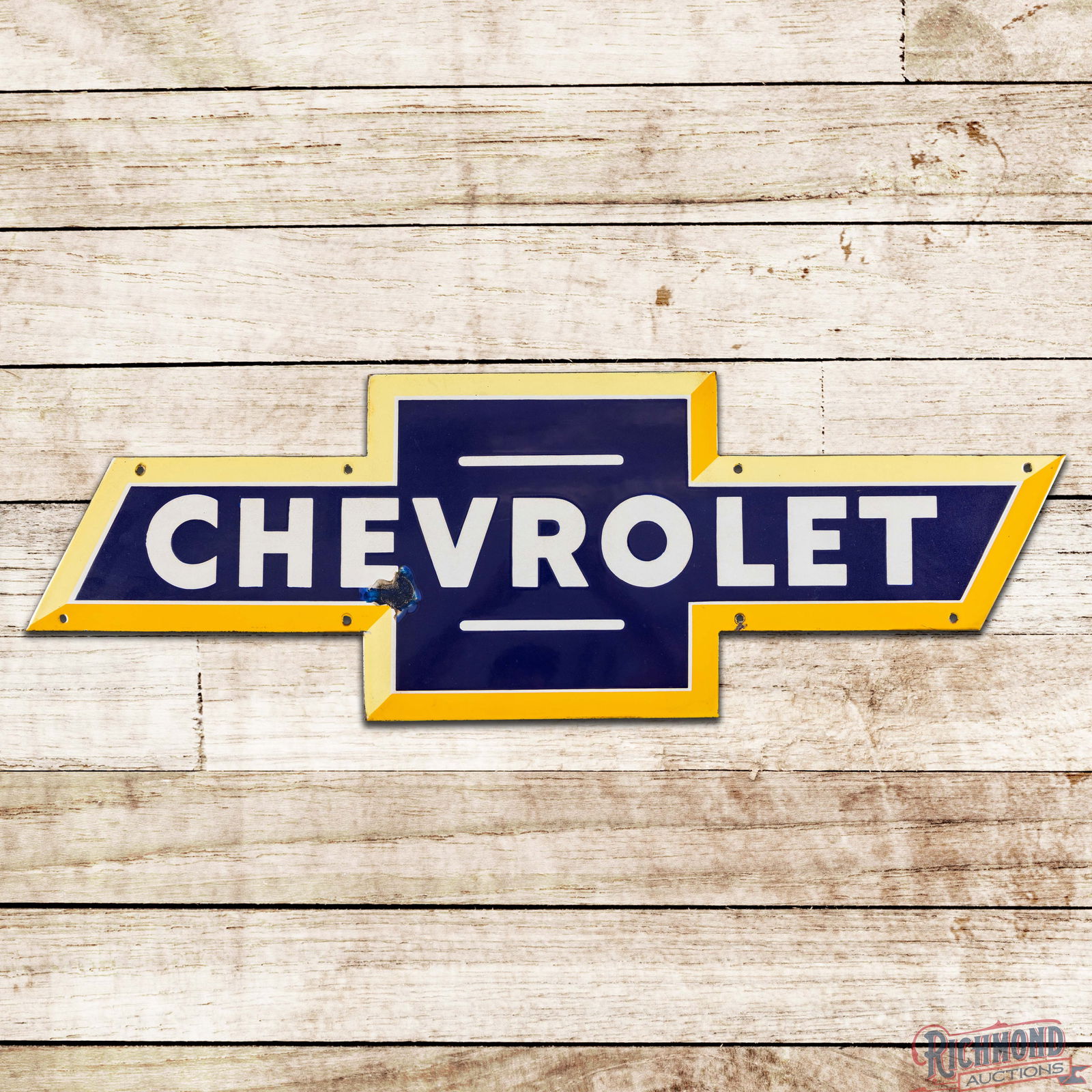 Chevrolet Automobiles Single Sided Porcelain Die Cut 3' Single Sided Porcelain Bowtie Sign: SSP (Single Sided Porcelain) die cut sign has excellent color and gloss. The display has minor discoloration with a chip on the lower edge of the first "E" in Chevrolet. The perimeter has light wear w