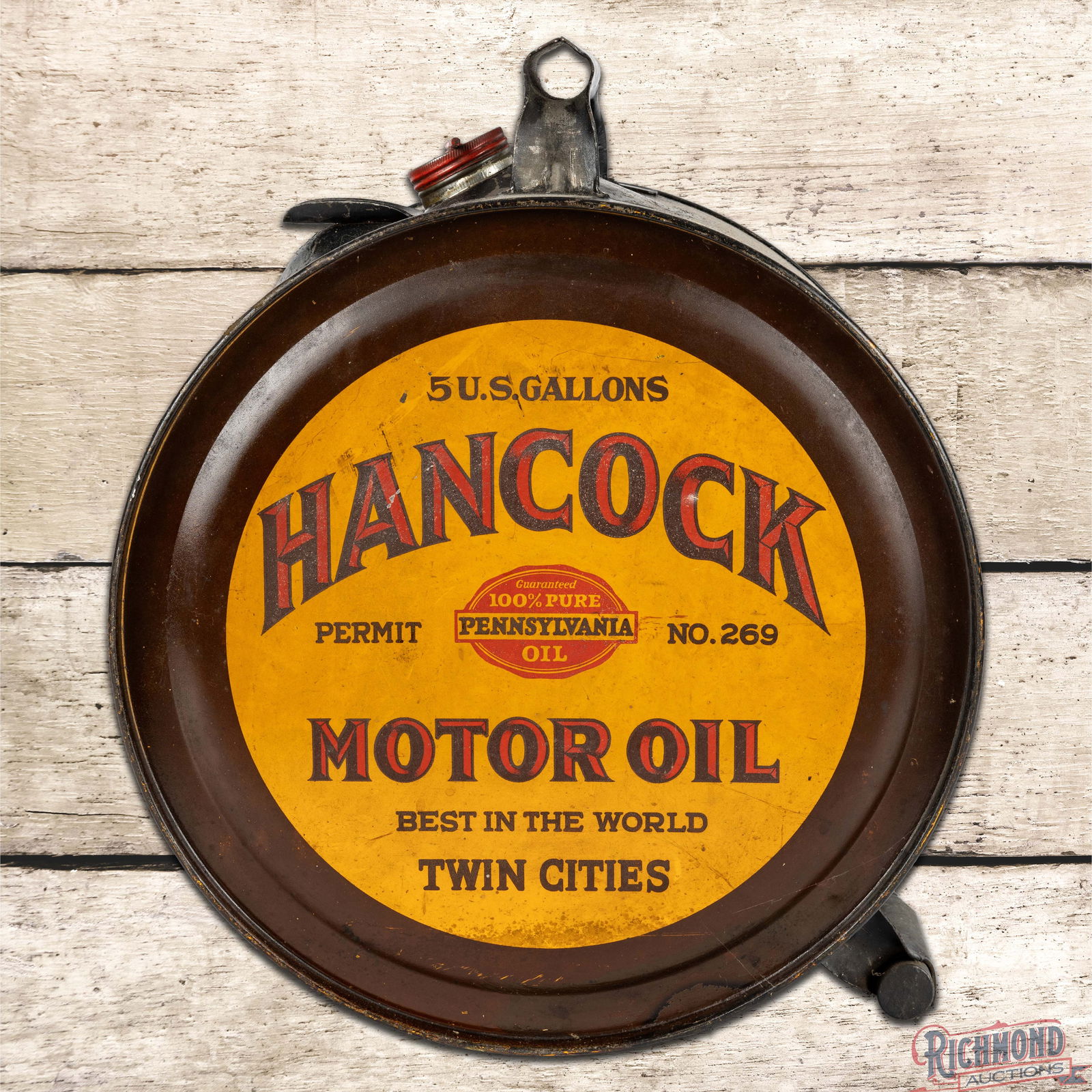 Outstanding Hancock Motor Oil "Best in the World" Twin Cities 5 Gallon Rocker Can: Empty five-gallon rocker can has excellent color and shine. The display has light wear with small paint chips and fine scratches. The reverse has slight fading with additional field wear. The sides