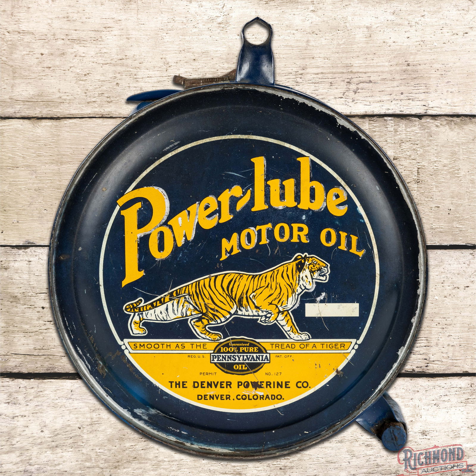 Power-Lube Motor Oil 5 Gallon Rocker Can Denver Powerine Co.: Iconic empty five-gallon rocker can has very good color and shine. Side #1 has fine scratches with surface imperfections and areas of added silver paint. The reverse is very similar to the display