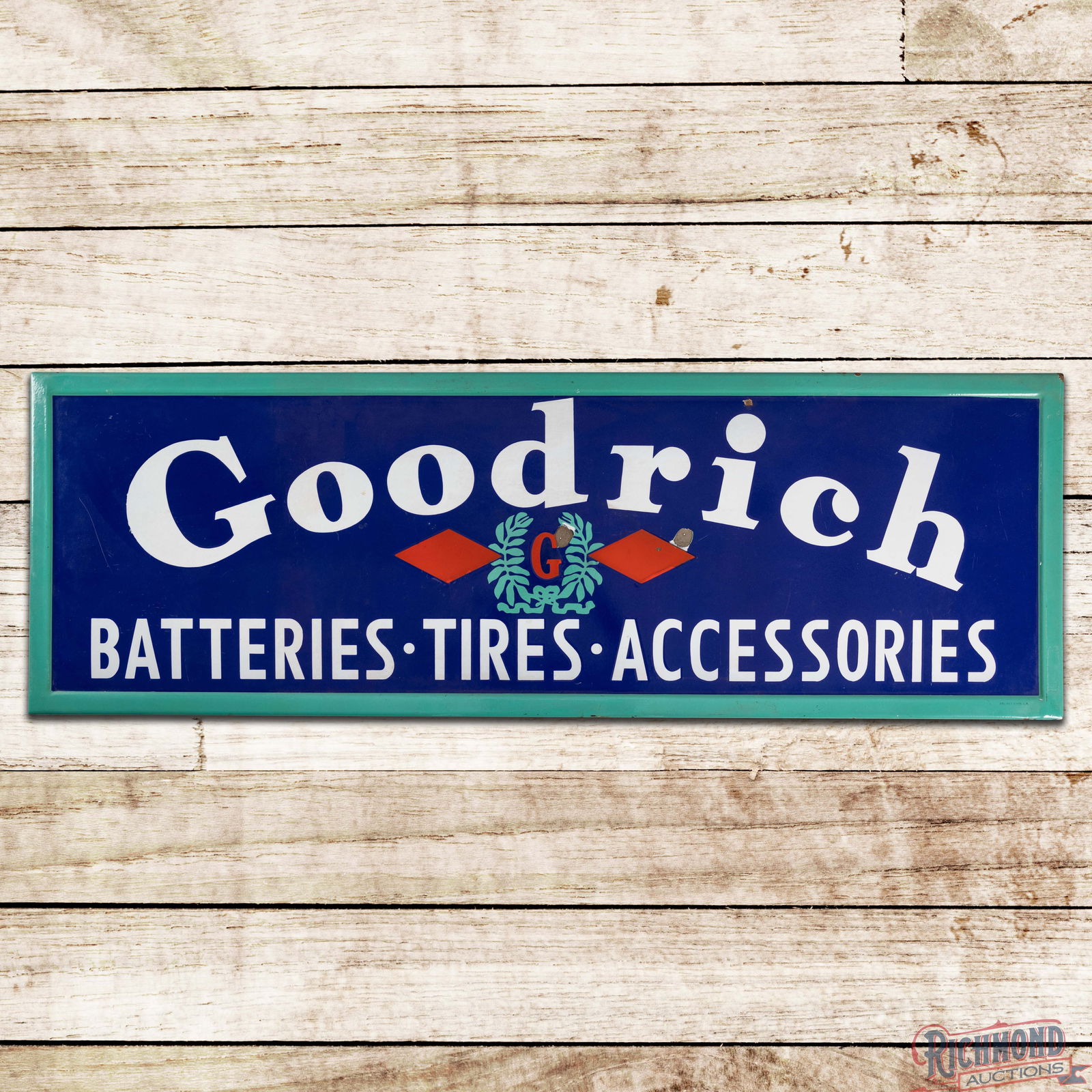 Goodrich Batteries Tires Accessories 5' Single Sided Porcelain Sign w/ Logo: SSP (Single Sided Porcelain) self-framed sign has very good color and gloss. The display has areas of surface wear with two larger chips near the logo and a smaller chip in the upper outer field. The