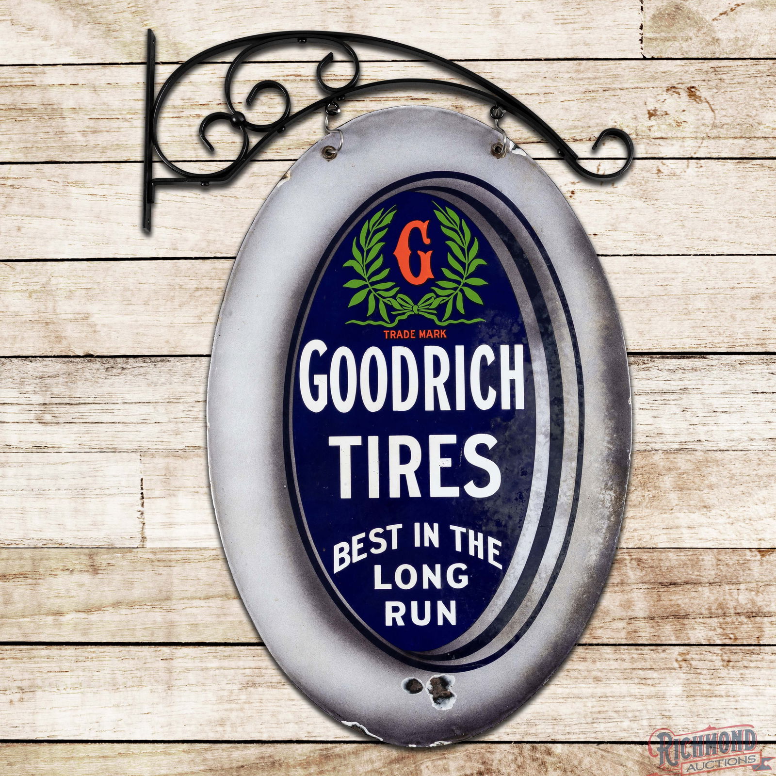 Amazing Goodrich Tires "Best in the Long Run" Double Sided Porcelain Logo Sign w/ Hanger: DSP (Double Sided Porcelain) sign with an added ornate hanging bracket has very good color and gloss. Side #1 has light wear in the field with minor areas of cloudiness and two chips in the lower oute
