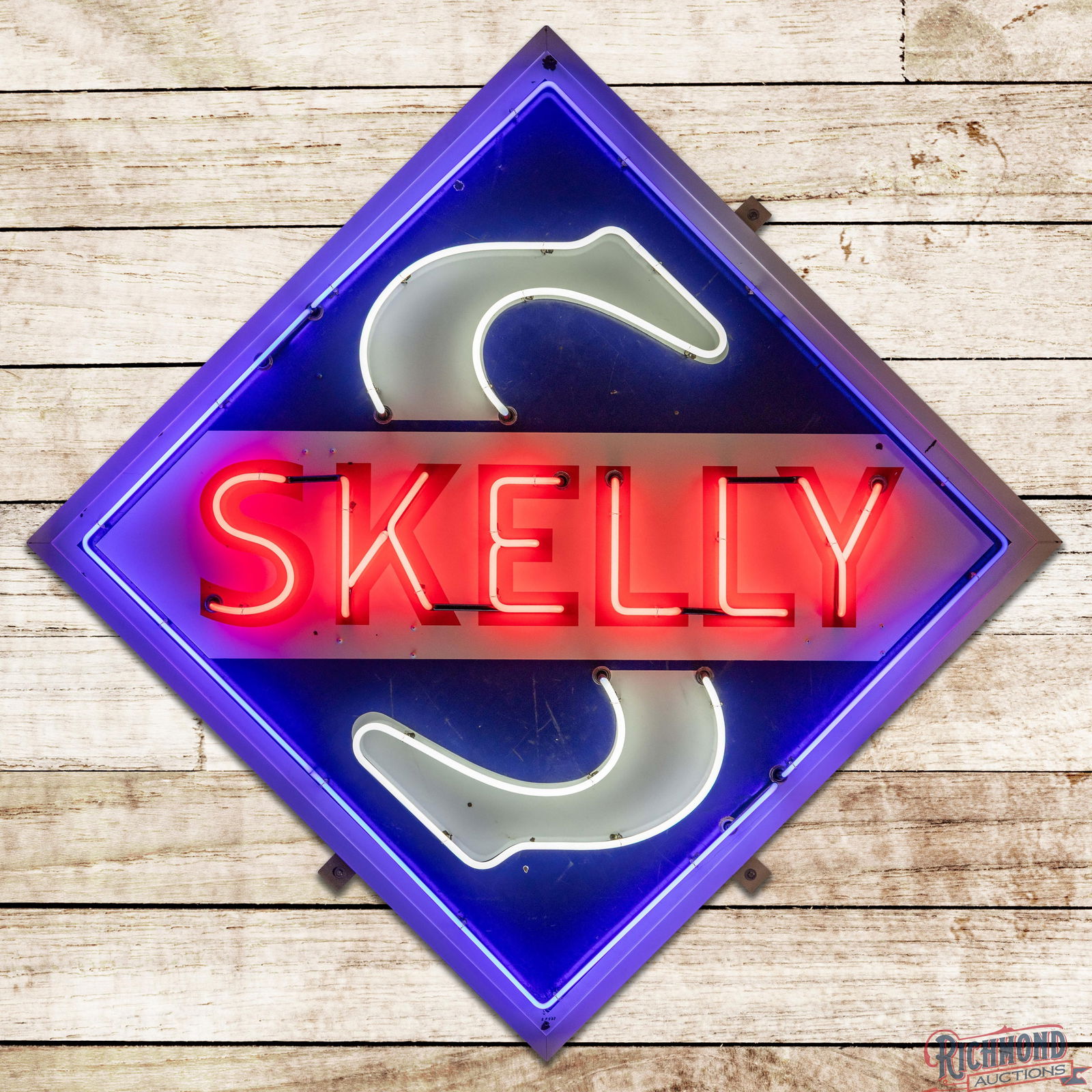 1962 Skelly Gasoline Service Station 7.5' Single Sided Porcelain Neon Sign w/ Logo: SSP (Single Sided Porcelain) sign with added neon and metal can has good color and gloss. The field has small chips with fine scratches and surface marks in the outer fields. The perimeter has small i