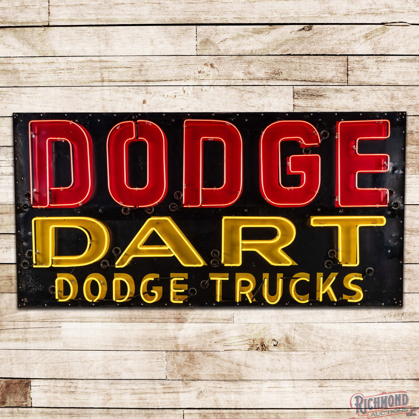 Dodge Dart Dodge Trucks 8' Reflective Single Sided Tin Neon Sign: SST (Single Sided Tin) sign with added neon and reflective lettering has very good color and shine. The sign is mounted on a new metal can which is in excellent condition. The fields exhibit general w