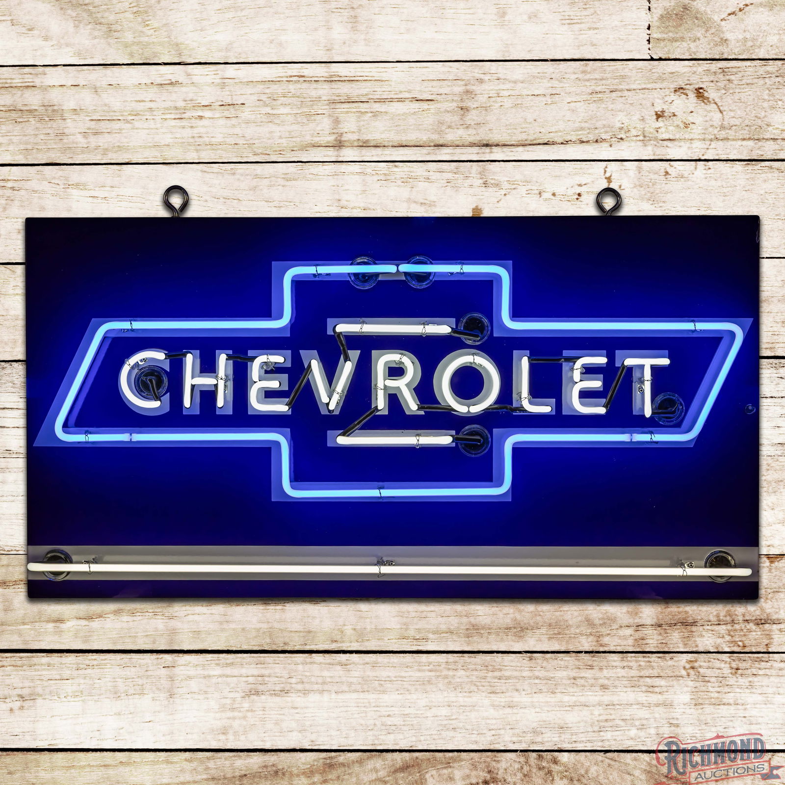 Chevrolet 4' Single Sided Porcelain Factory Neon Sign w/ Bowtie: SSP (Single Sided Porcelain) rolled edge factory neon sign with a new metal can has outstanding color and gloss. The sign features vibrant two-color neon with the iconic Chevrolet bowtie graphic in th