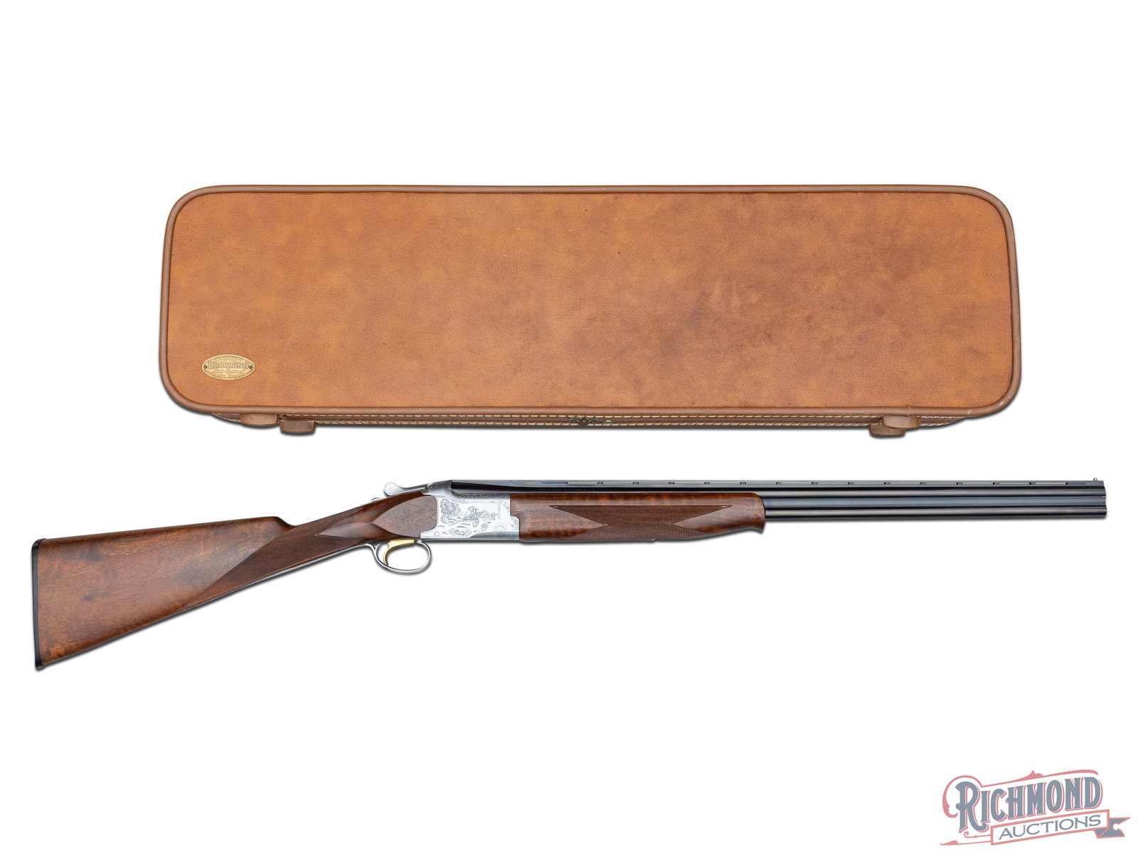 1979 Cased Browning Superposed .410 Gauge Grade II Engraved Over/Under Shotgun Straight Stock: Manufactured by Miroku for Browning in 1979 in a very uncommon configuration. Features 26" blued Special Steel ventilated rib barrel with nickel bead front sight. Chambered for 2-1/2" and 3" shells wi