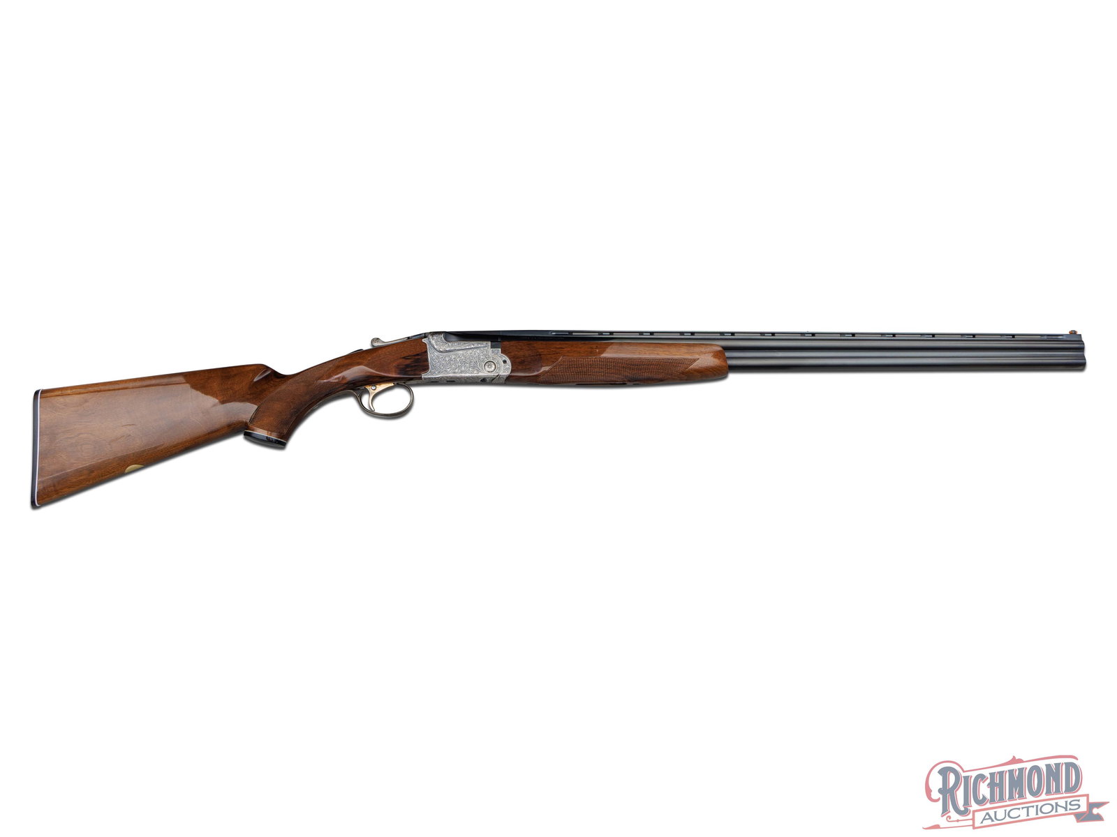 SKB Arms Model 600 Over/Under 28 Gauge Engraved Shotgun: Manufactured by SKB in Japan. This shotgun features 28" ventilated rib blued barrel with a nickel mid-bead and fiber optic front bead sight. Chamber proof-tested for 2-3/4" shells. Choked Full on top
