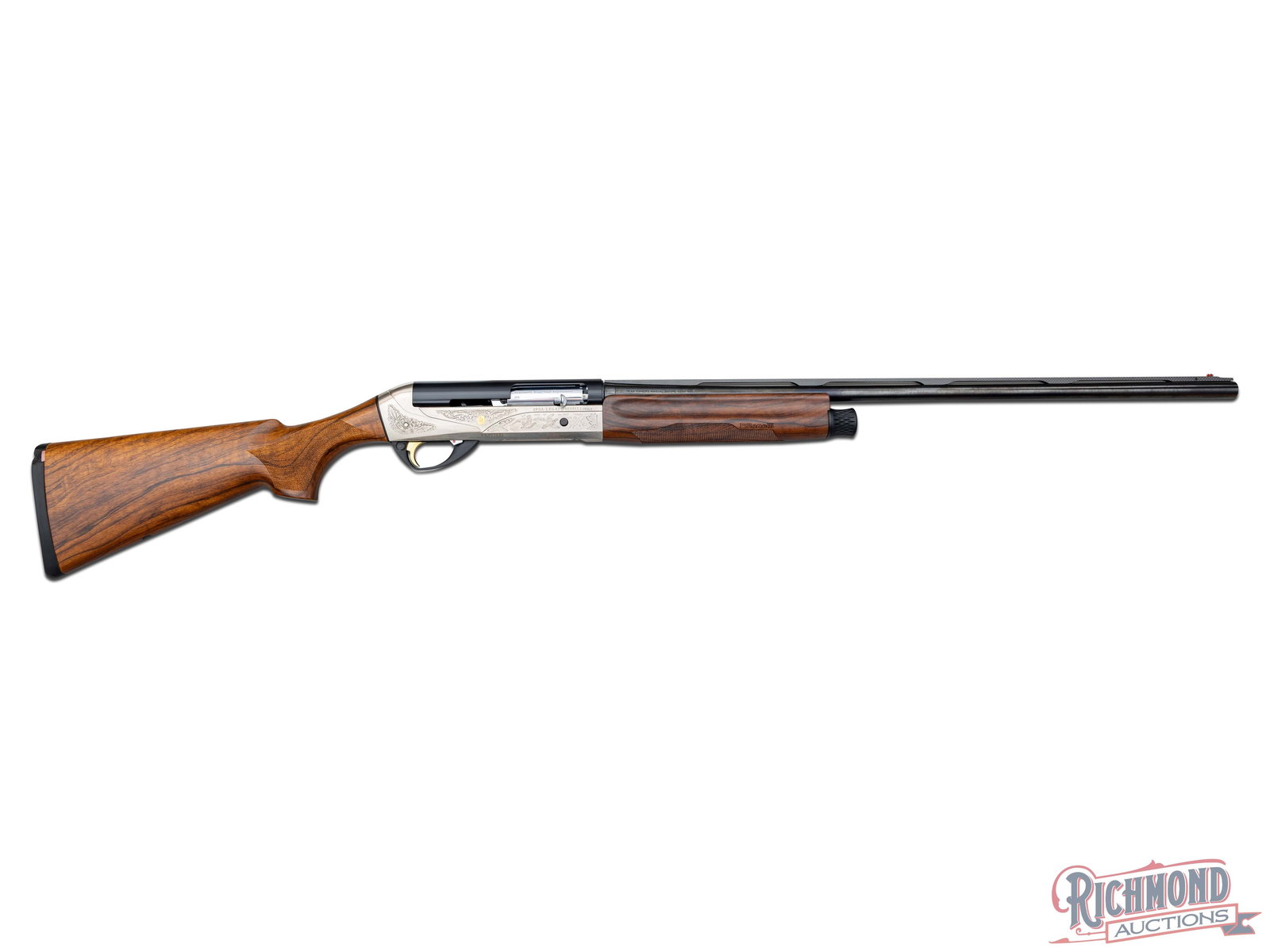 High Condition Benelli Legacy Engraved 28 Gauge Semi-Auto Shotgun With Crio Barrel: Manufactured in Italy by Benelli. This lightweight shotgun features a 25-1/2" Crio barrel with a carbon fiber ventilated rib, nickel mid-bead and fiber optic front bead sight. 28 gauge chambered for 2