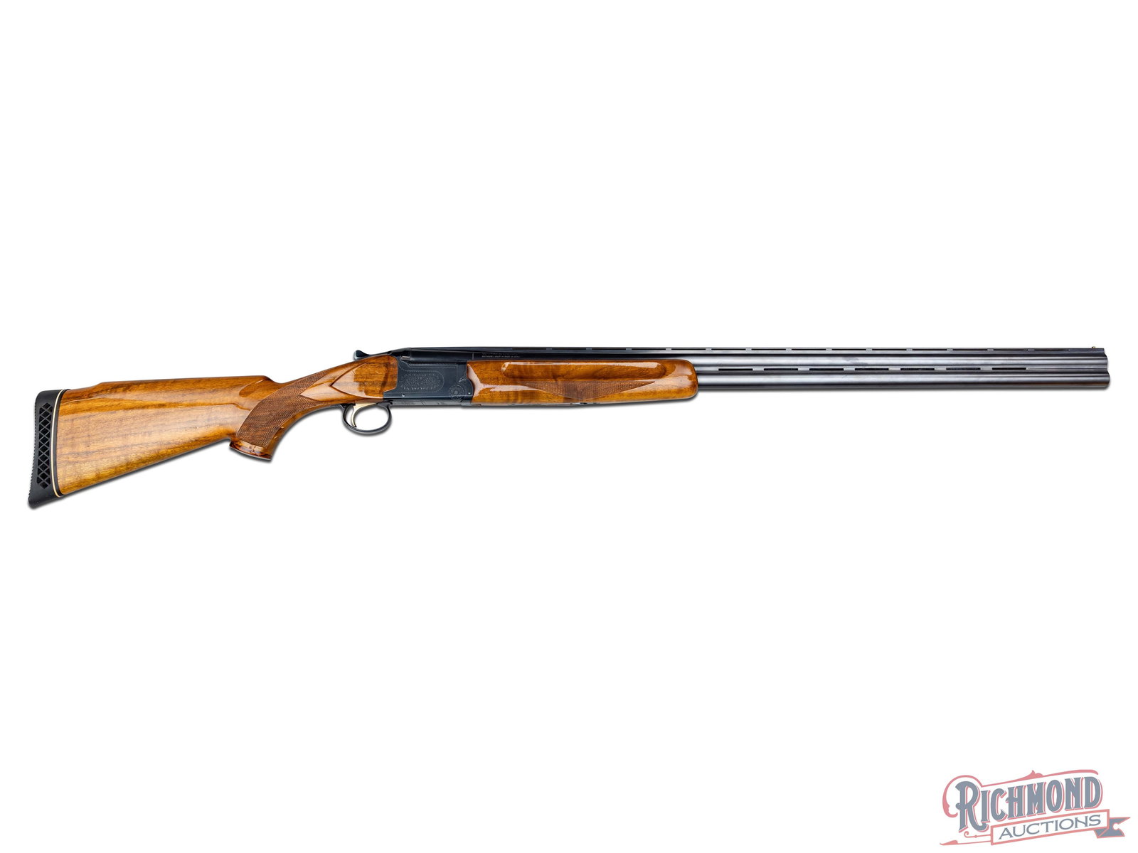 Weatherby Olympian 12 Gauge Over/Under Shotgun 32" Barrels: Manufactured by Weatherby in Japan between 1977 and 1981. Features 32" Nikko Proof Steel dual ventilated rib barrels with brass mid-bead and front bead sight. Marked "12 GA - 2-3/4" CHAMBER" on the le
