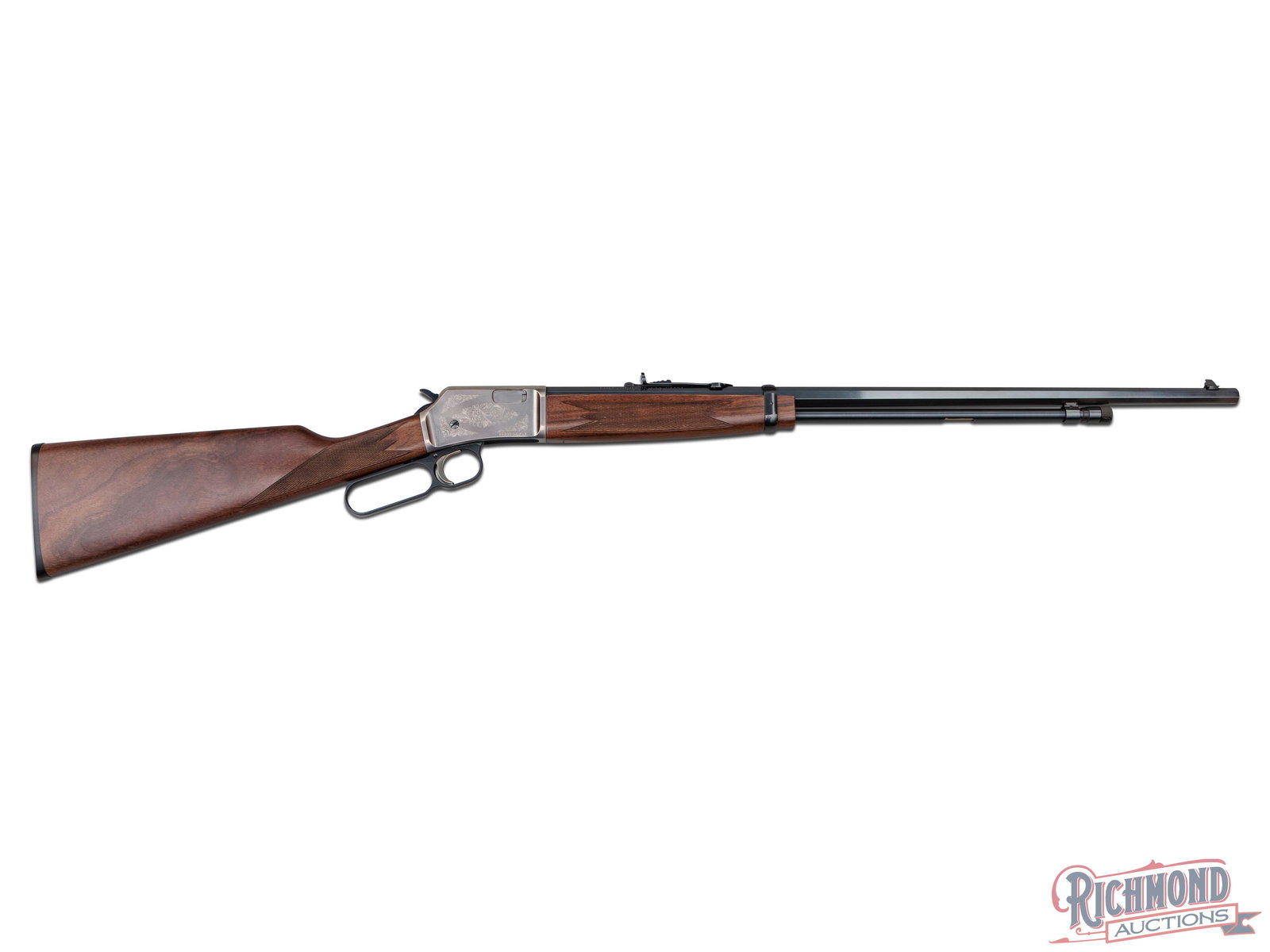 Browning BL-22 Grade II Octagon Lever Action .22 S/L/LR Rifle: Manufactured by Miroku for Browning. This grade II rifle features a 24" blued octagon barrel with rear semi-buckhorn adjustable sight and blade with brass bead front sight. Lever action with gold wash