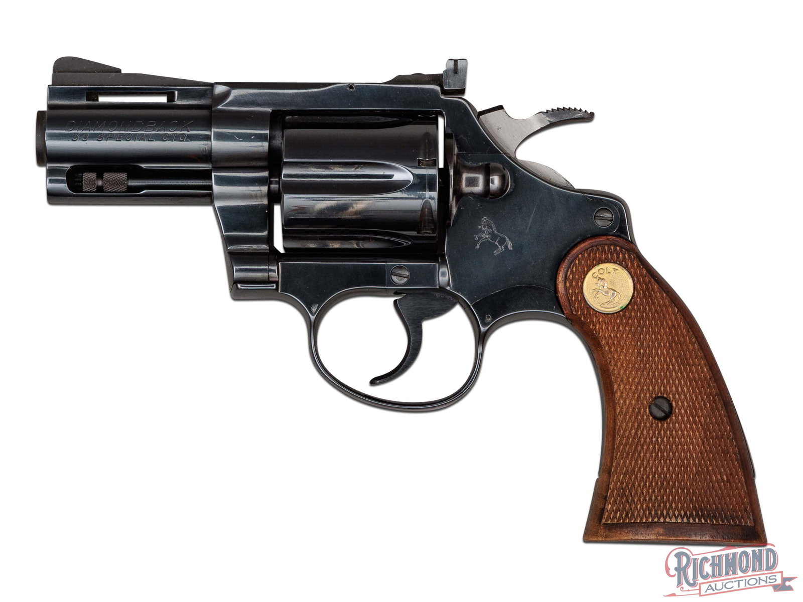 1977 Colt Diamondback .38 SPL Double Action Revolver in Scarce 2-1/2": Manufactured by Colt PTFA Mfg in 1977. This snake gun features the more scarce 2-1/2" ventilated rib barrel with rear adjustable square notch and serrated ramped blade front sight. Left side is stampe