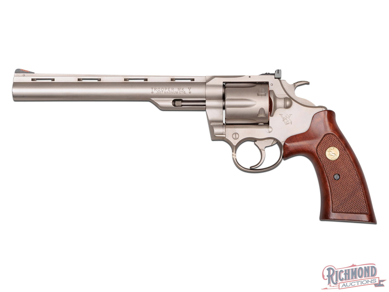 1982 Colt Trooper MK V .357 Magnum Double Action 8" Revolver in Electroless Nickel: Manufactured by Colt PTFA Mfg in 1982. Features an 8" ventilated rib barrel with rear adjustable square notch sight and ramped blade front with Hi-Viz insert. Left side of the barrel is stamped "TROOP