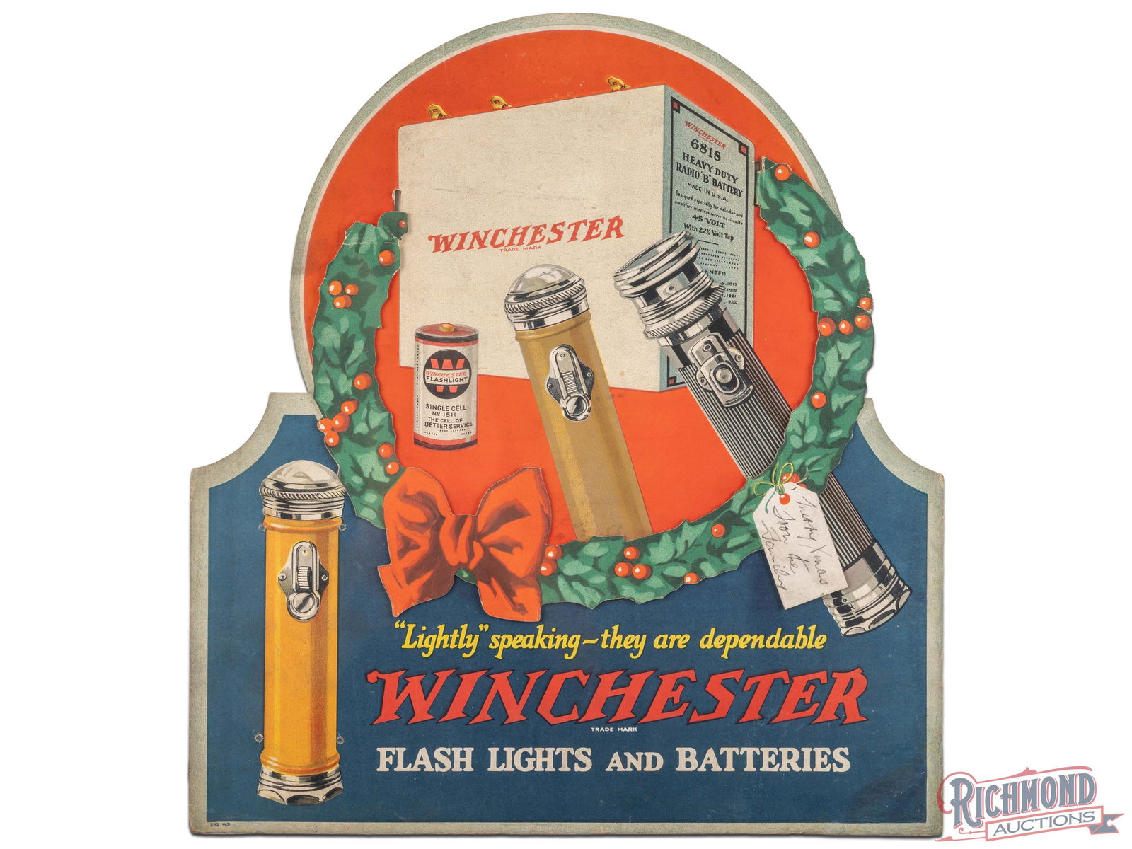 Winchester Flash Lights and Batteries 3D Cardboard Adverting Display Sign: Single sided die cut three-dimensional sign has very good color. The field has areas of slight toning and discoloration with bends on the upper edges of the wreath. The perimeter has areas of light we