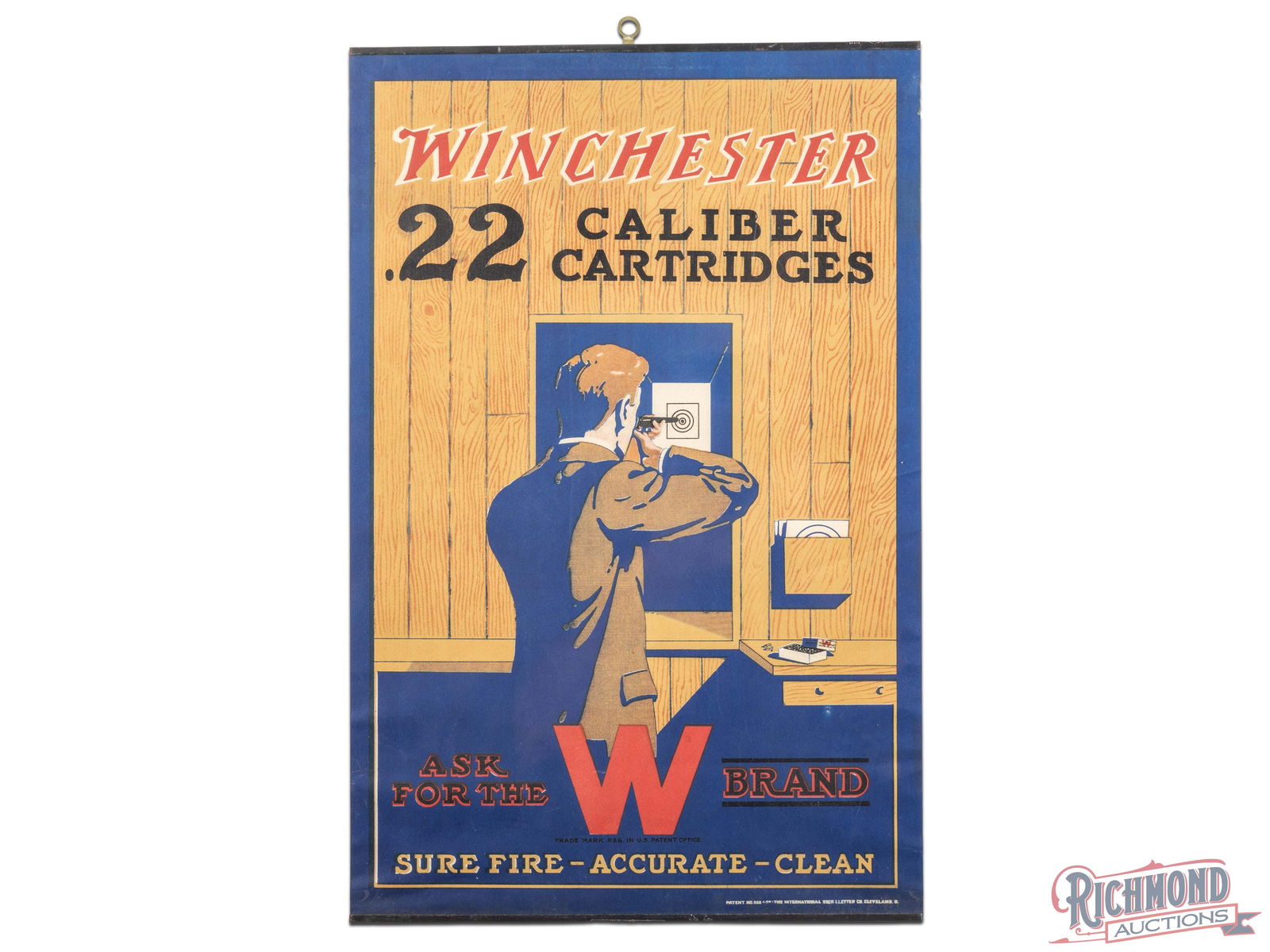 Winchester .22 Caliber Cartridges "Sure Fire - Accurate - Clean" Advertising Display Poster Sign: Single sided advertising poster has excellent color. The field is clean. The outer fields and perimeter has bends with light wrinkling. Both metal bands are present and the poster has been shrink wrap